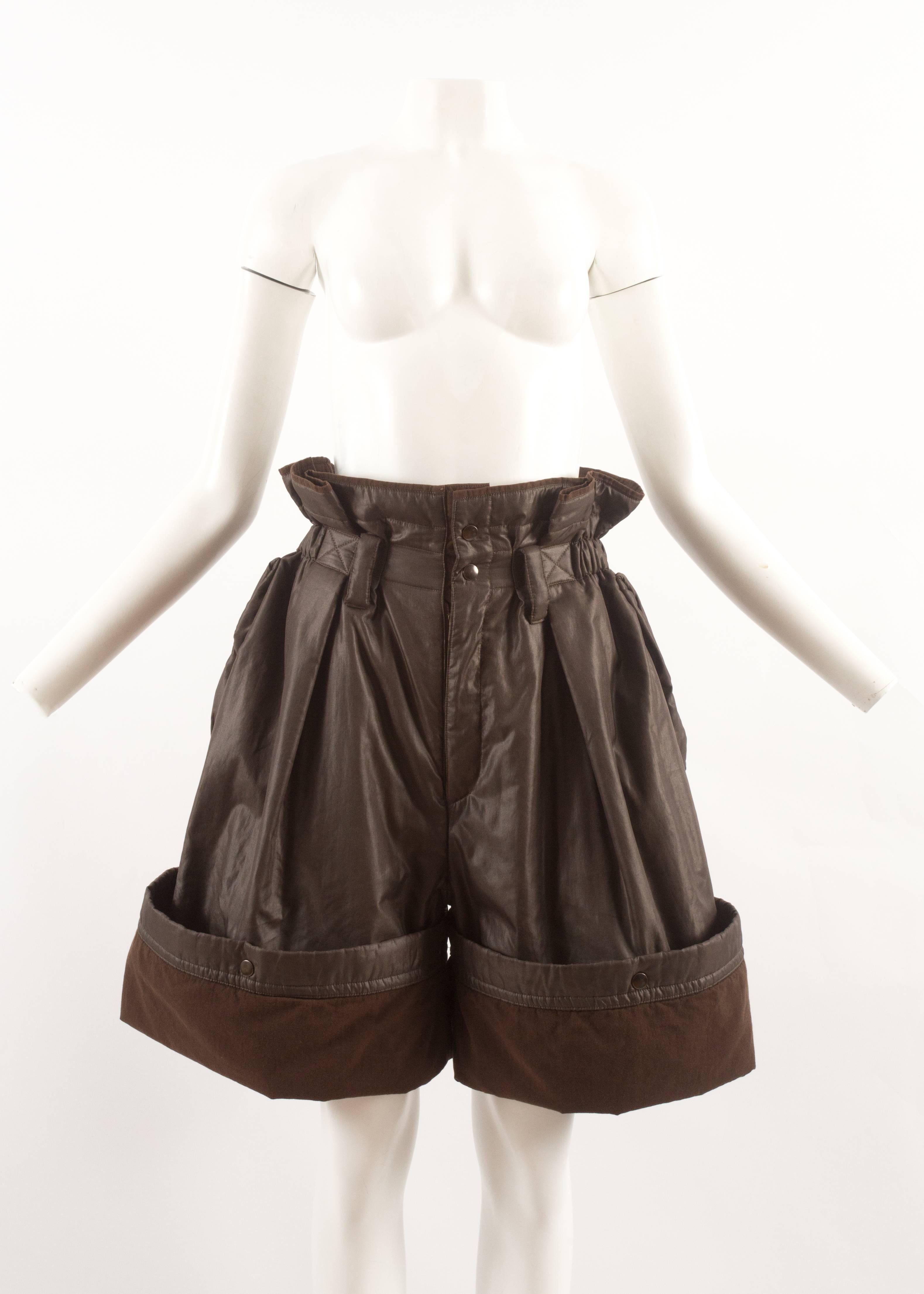 Issey Miyake Autumn-Winter 1983 oversized nylon shorts with paper-bag elastic waist, two side pockets and snap button closures on the hem to lengthen or shorten.
