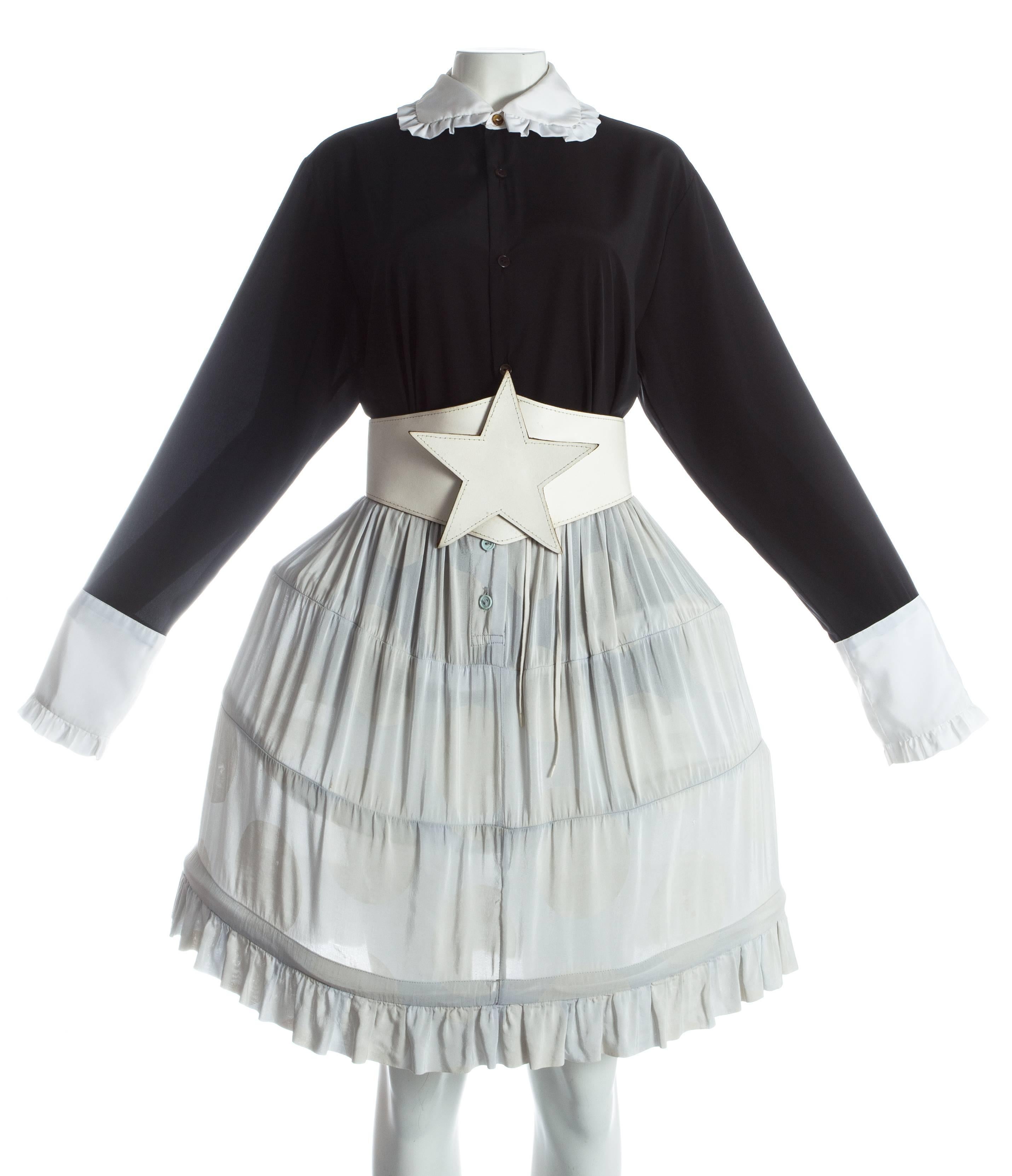 - polka dot print mini-crini skirt with ruffled hem 
- white leather star belt 
- black blouse with white ruffled collar and cuffs 

Spring-Summer 1985 
