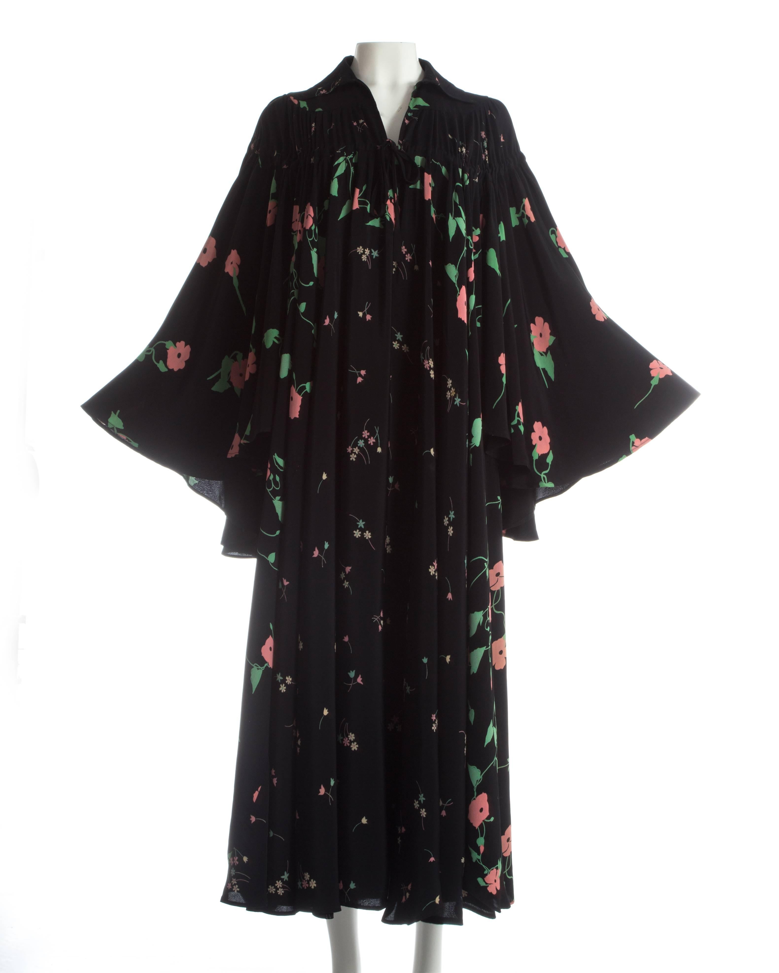 - 'Busy Lizzie' floral pink and green print by Celia Birtwell
- Drawstring fastening on yoke 
- Extra wide angel sleeves 
- Masses of fabric 

ca. 1971 