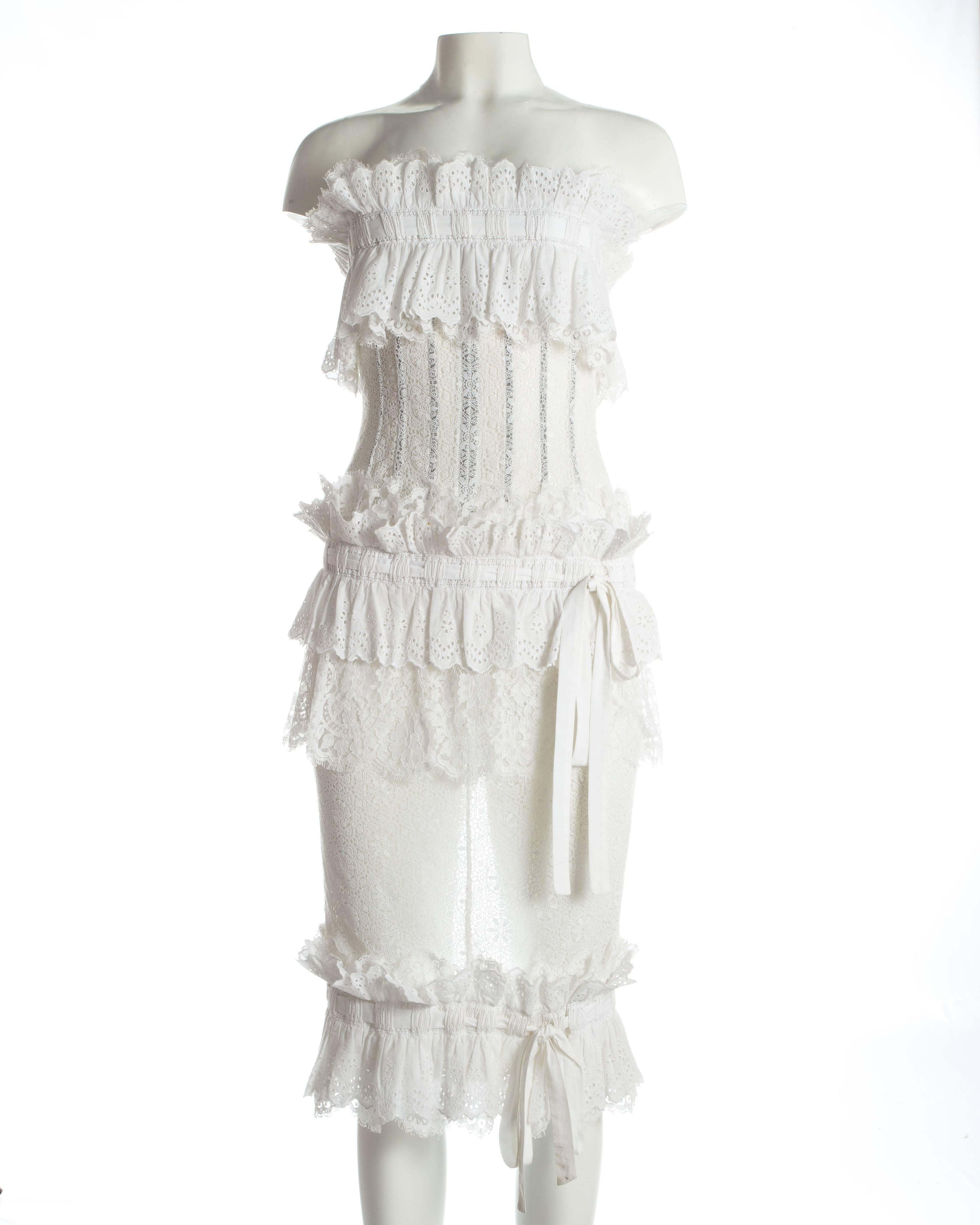 - Broderie Anglaise and lace 
- Internal boning on bust acting as a corset
- Exposed metal zipper at centre back 
- Leg slit on centre back seam 
- 3 drawstring fastenings witch can fastening with bows or knots 

Spring-Summer 2006