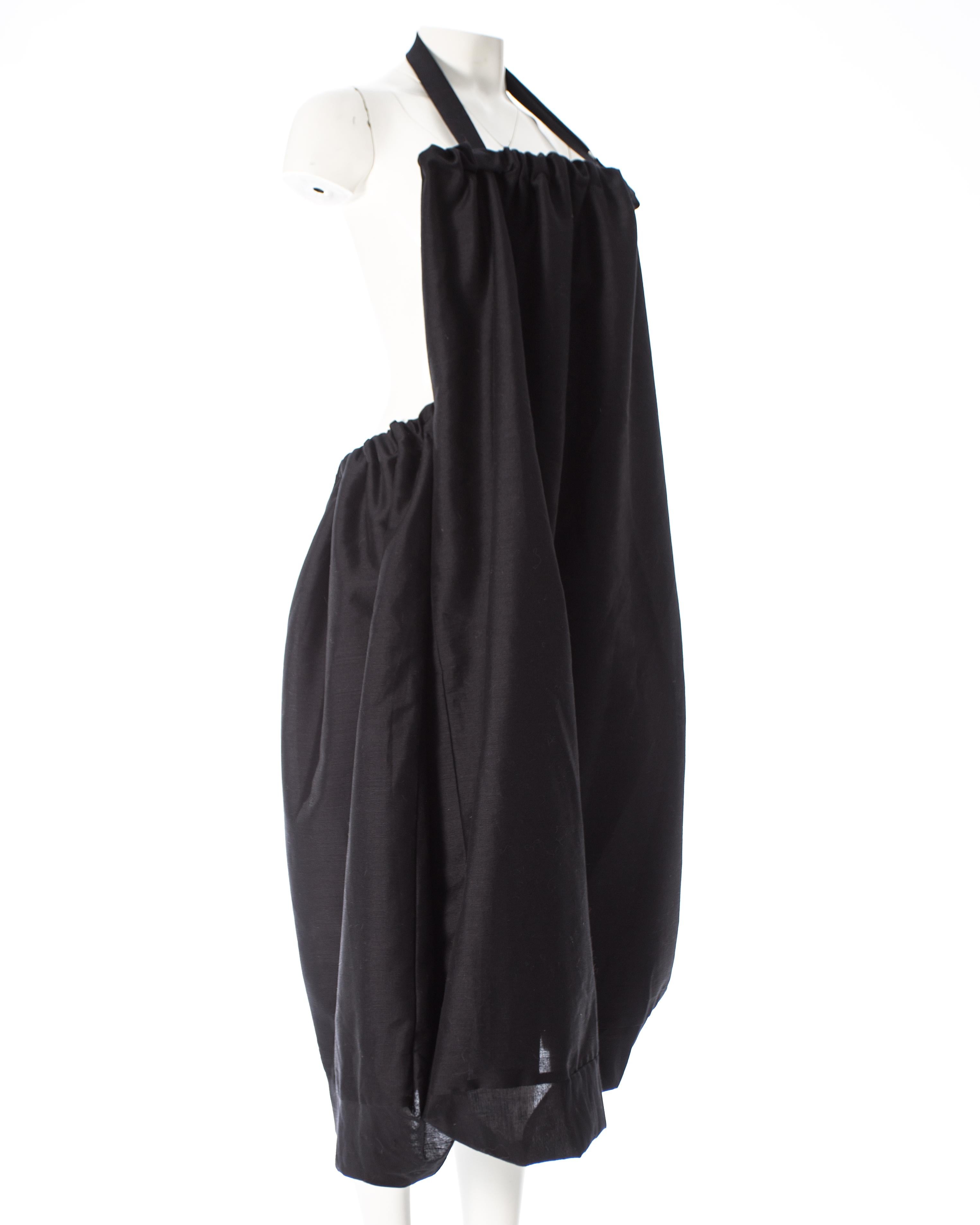- Full skirt with bubble hem and irregular seams 
- Internal functional bag with ruched closure and adjustable shoulder strap
- Transforms into a dress or shoulder bag 

Spring-Summer 2001