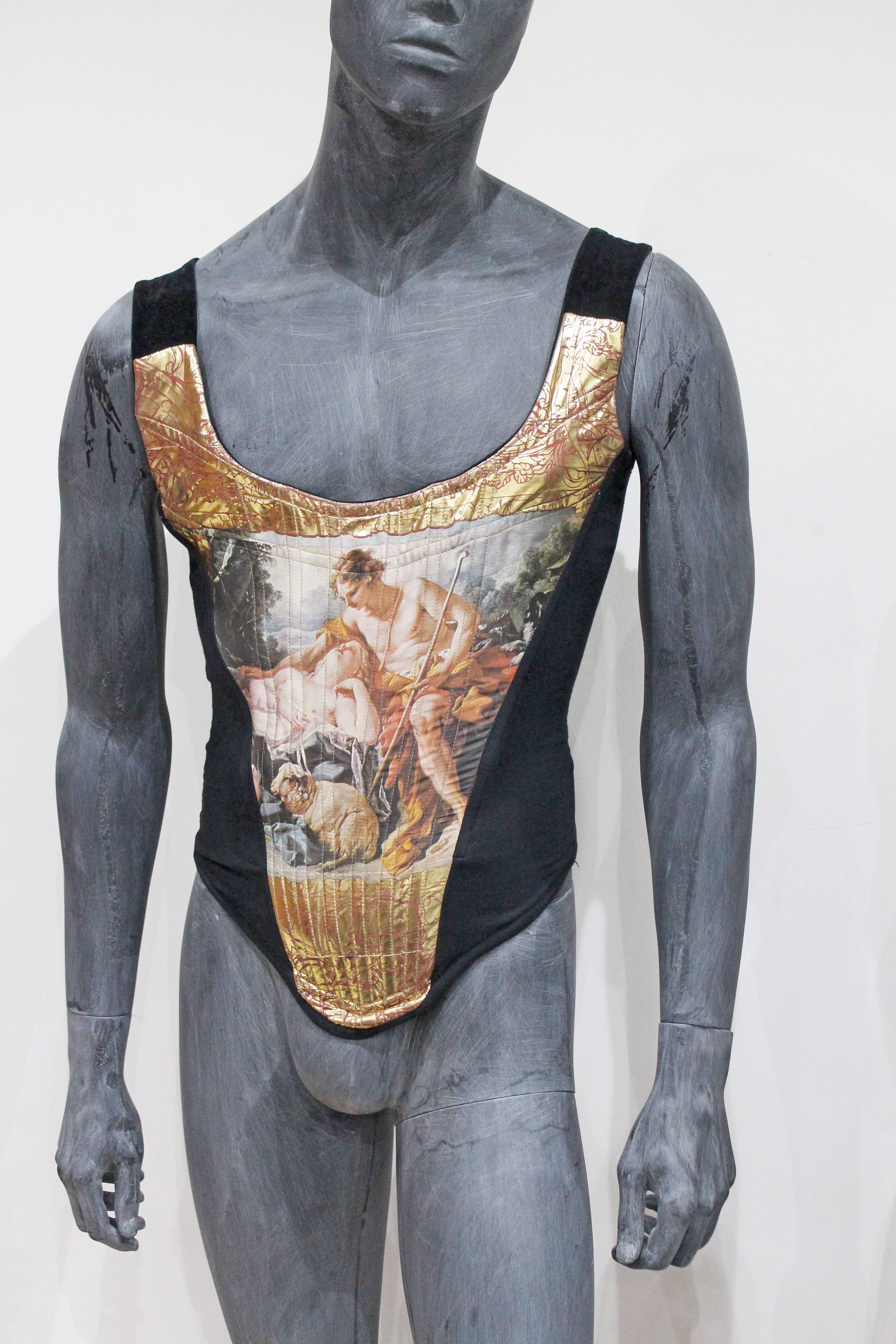 Very rare and highly collectible Mens Vivienne Westwood corset of synthetic blend with a depiction of François Boucher's painting of Daphnis and Chloe printed on front panel. Features classical motifs printed in gold and mauve and corset sides are