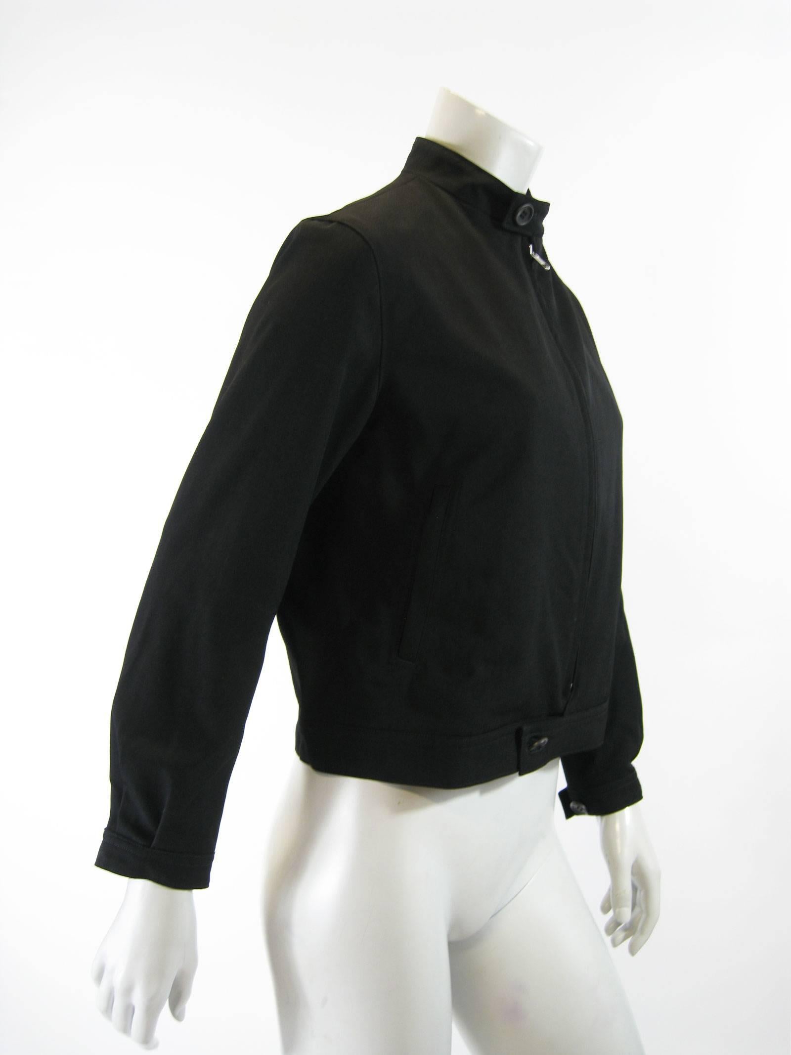 Y's by Yohji Yamamoto classic cut black bomber jacket.
Mock neck with button closure.
Sturdy two way zipper.
Button closure at waist.
Slanted side pockets.
Button closures at wrists.
Fully lined.
Tagged a size 3.

Chest: 38
