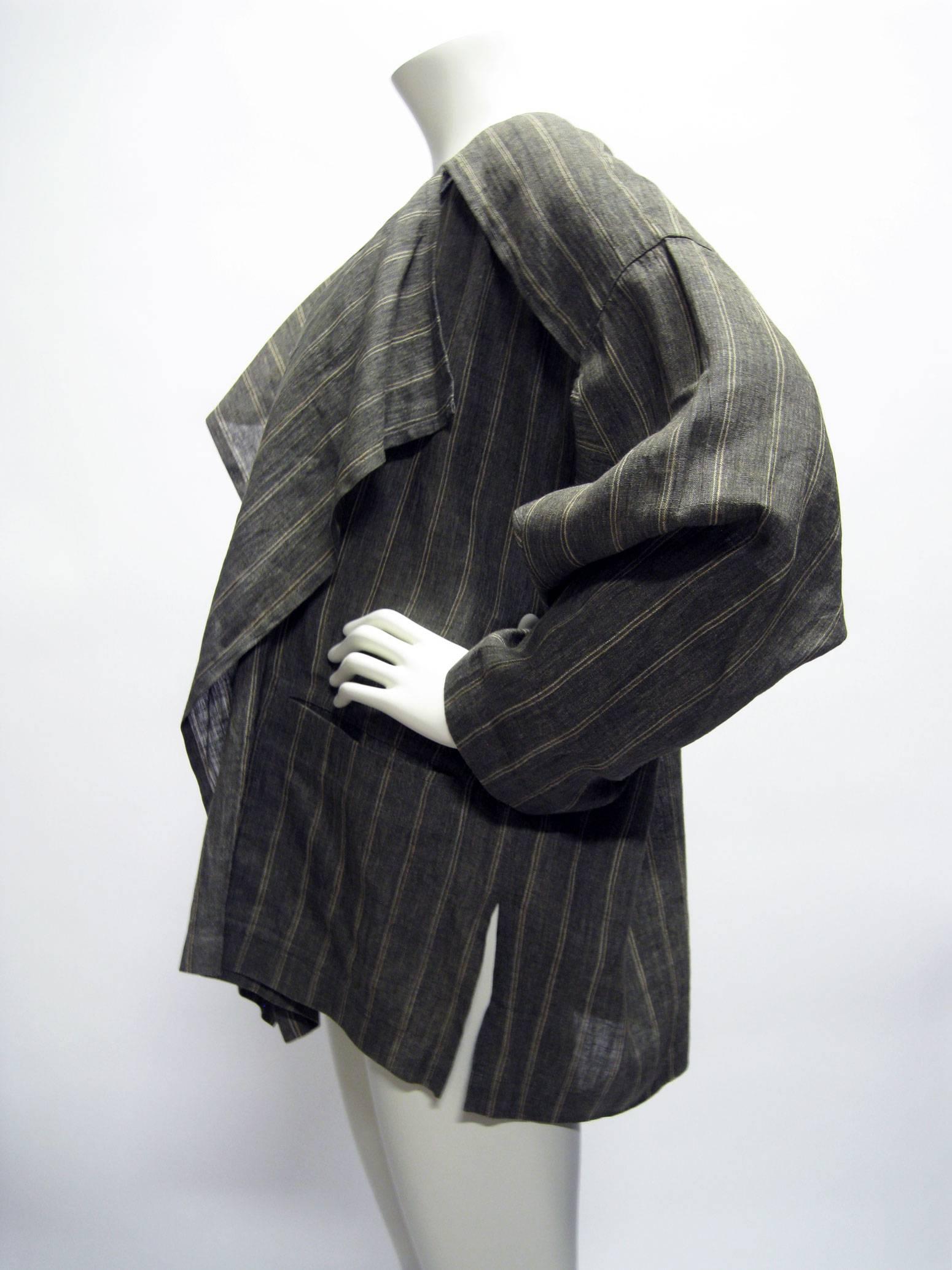 Early Miyake draped open jacket.
Tagged men's size but unisex style.
Gray linen with cream striped.
Two front patch pockets.
Back placket on shoulders.
Tagged a size 9 (Japan).