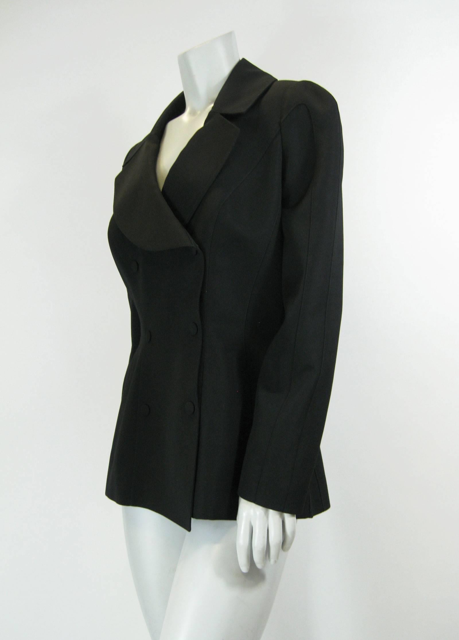 Vintage Thierry Mugler black shaped jacket.
80's does 40's style.
Double breasted with hidden snap closures.
Deep neckline.
Slit pockets.
Lined.
No size tag.

Bust: 38”
Waist: 30