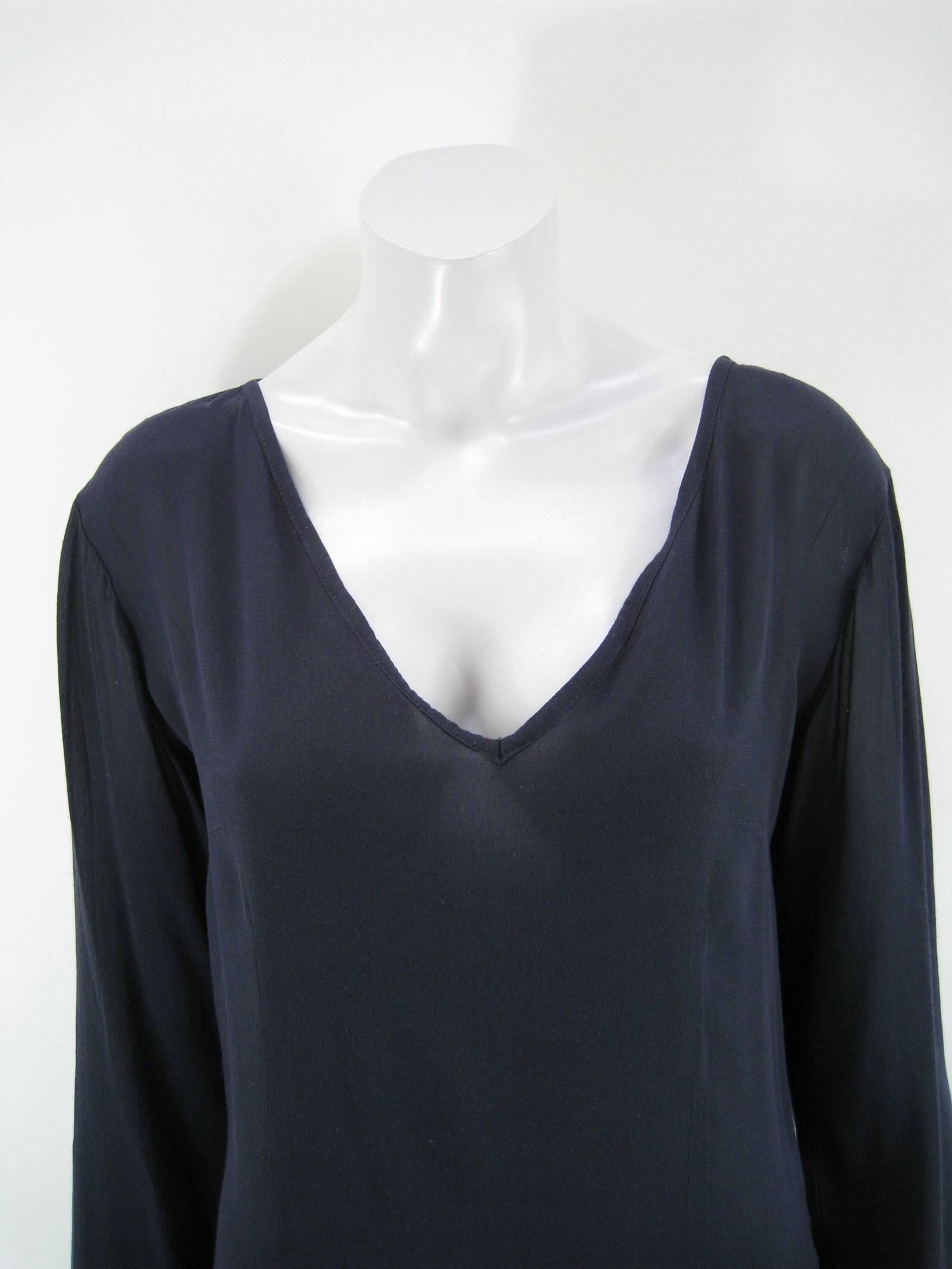 Slinky D&G navy blue shift dress.
Easy minimal shape.
Semi-sheer.
Deep V-neck.
Back zipper with hook & eye.
Tagged a size 42.
