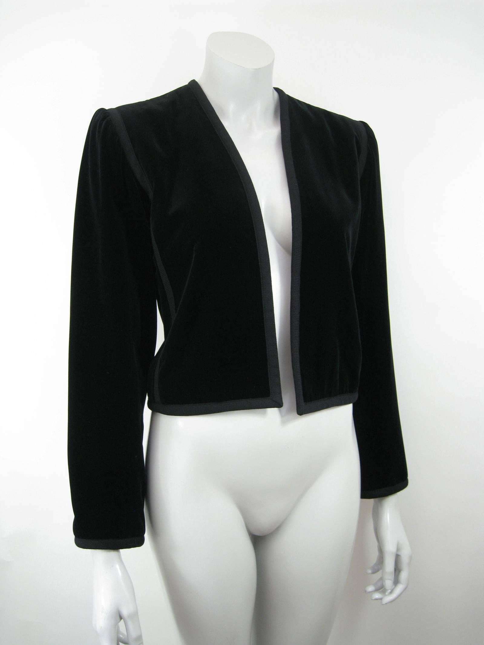 YSL Rive Gauche black velvet cropped jacket.
Bolero style.
No closures.
Slightly puffed/pleated shoulder.
Textured ribbon trim detailing.
Lined.
Tagged size 36.