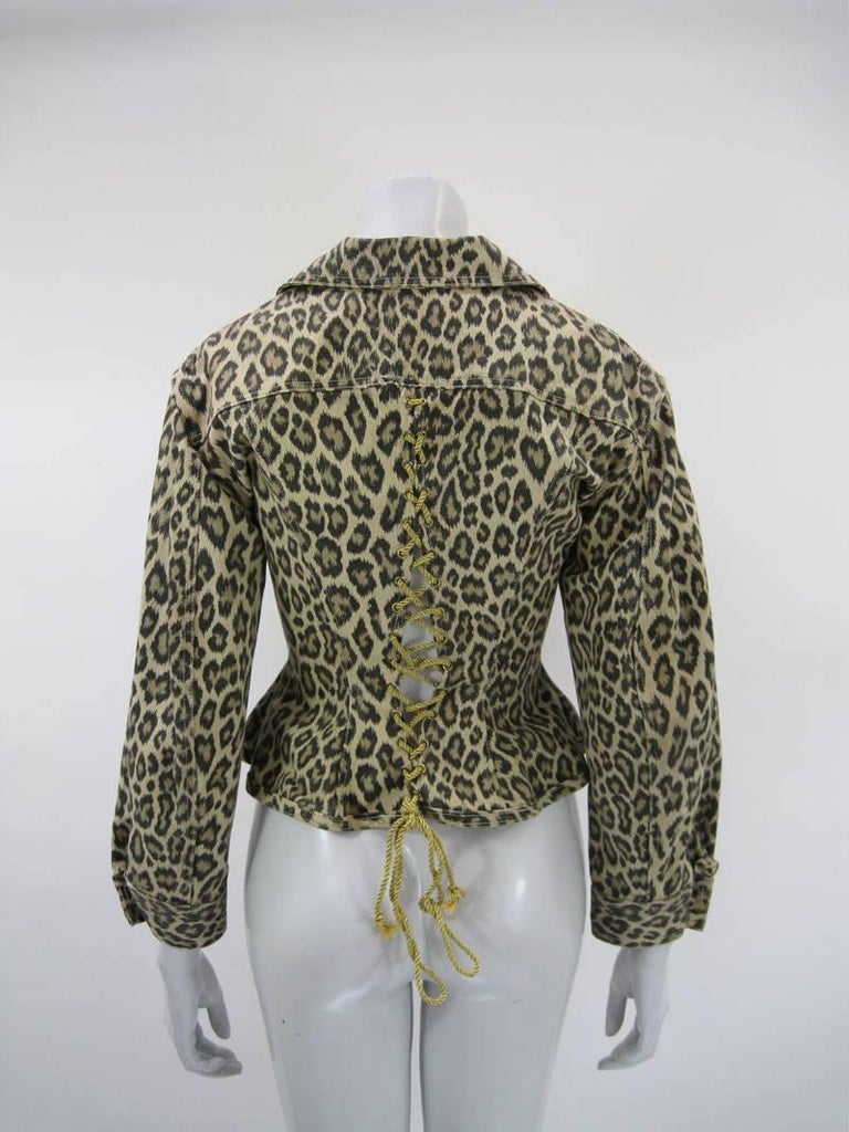 Fabulous leopard print corseted jacket by Junior Gaultier. 

Back corset with gold cord tie. Balloon sleeves.

Fitted through waist with peplum hem.

Two chest pockets with buttons.

100% cotton

This is in excellent pre-owned condition with no