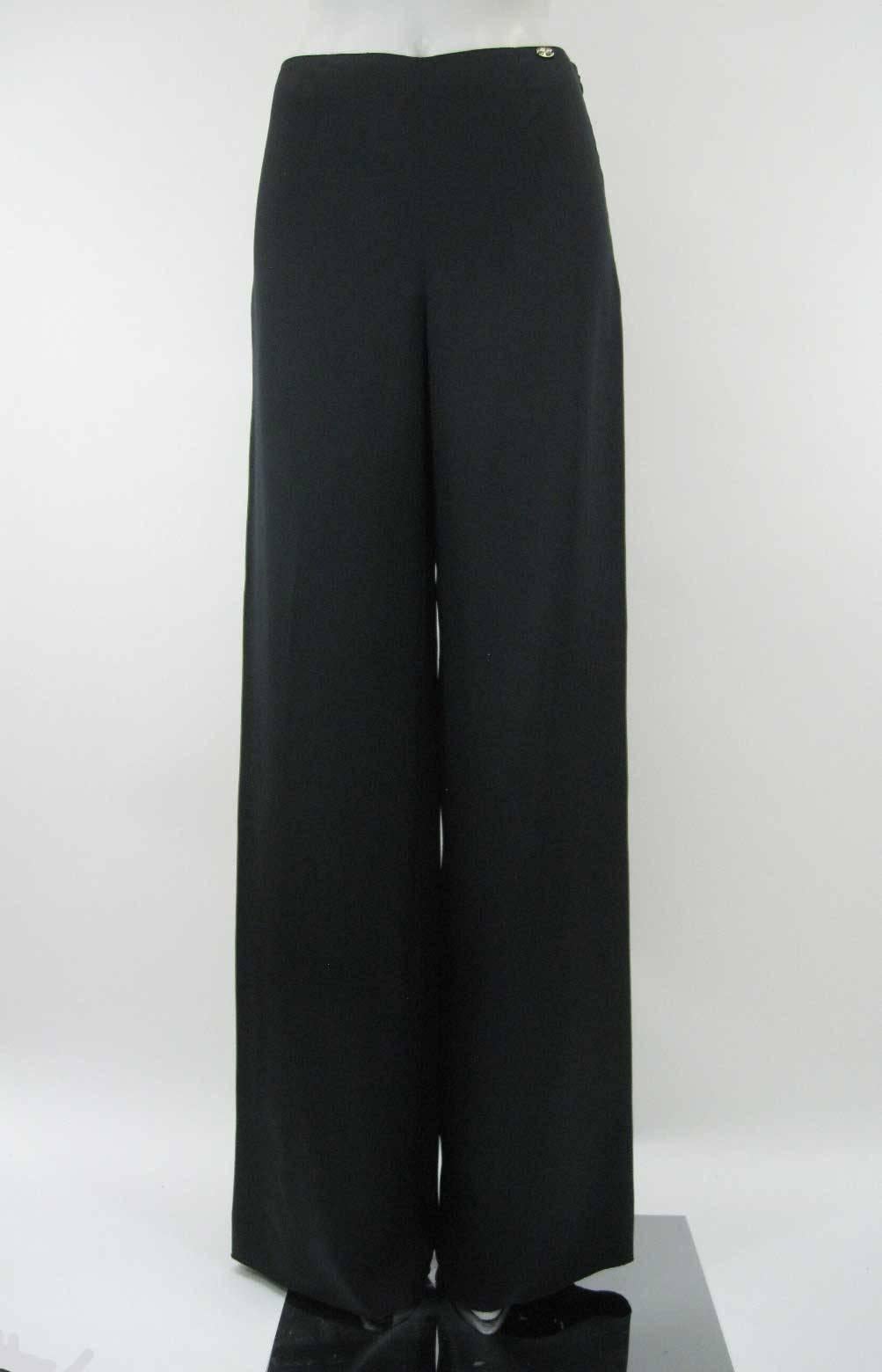Elegant and classic black Chanel palazzo pants.

Luxurious silk satin fabric.

Mid rise with hidden side zipper.

Front and back darting.

Chanel name plate on left hip.

Fully lined.

Tagged a size 36.

This is in excellent pre-owned condition with