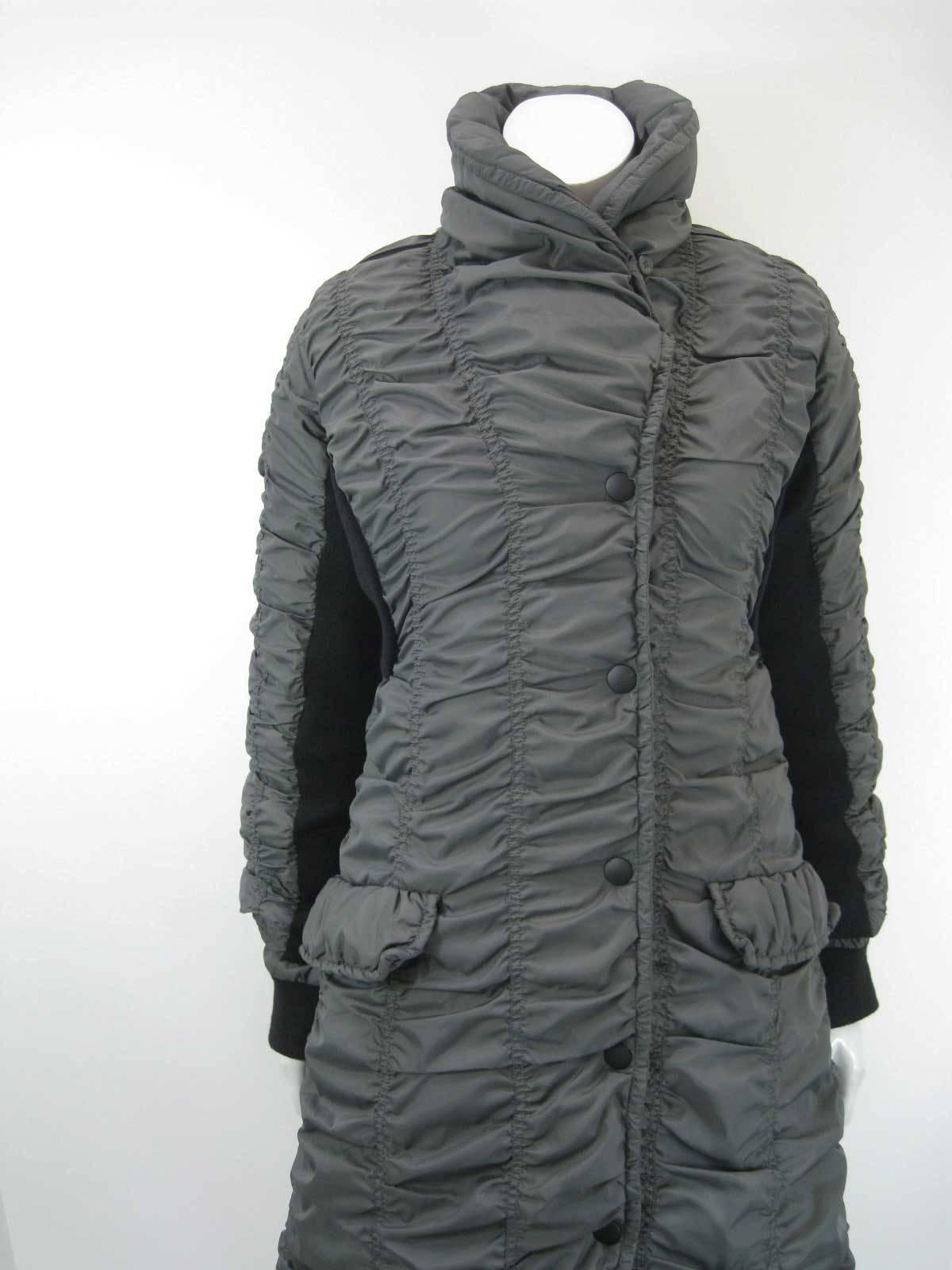 Fabulous Issey Miyake long ruched puffer coat.

Shawl collar with button and eye closure.

Sleeves are two layers- under layer is light weight poly outer wrapped in tube of ruched down fill poly with black ribbed knit stretchy panels under sides