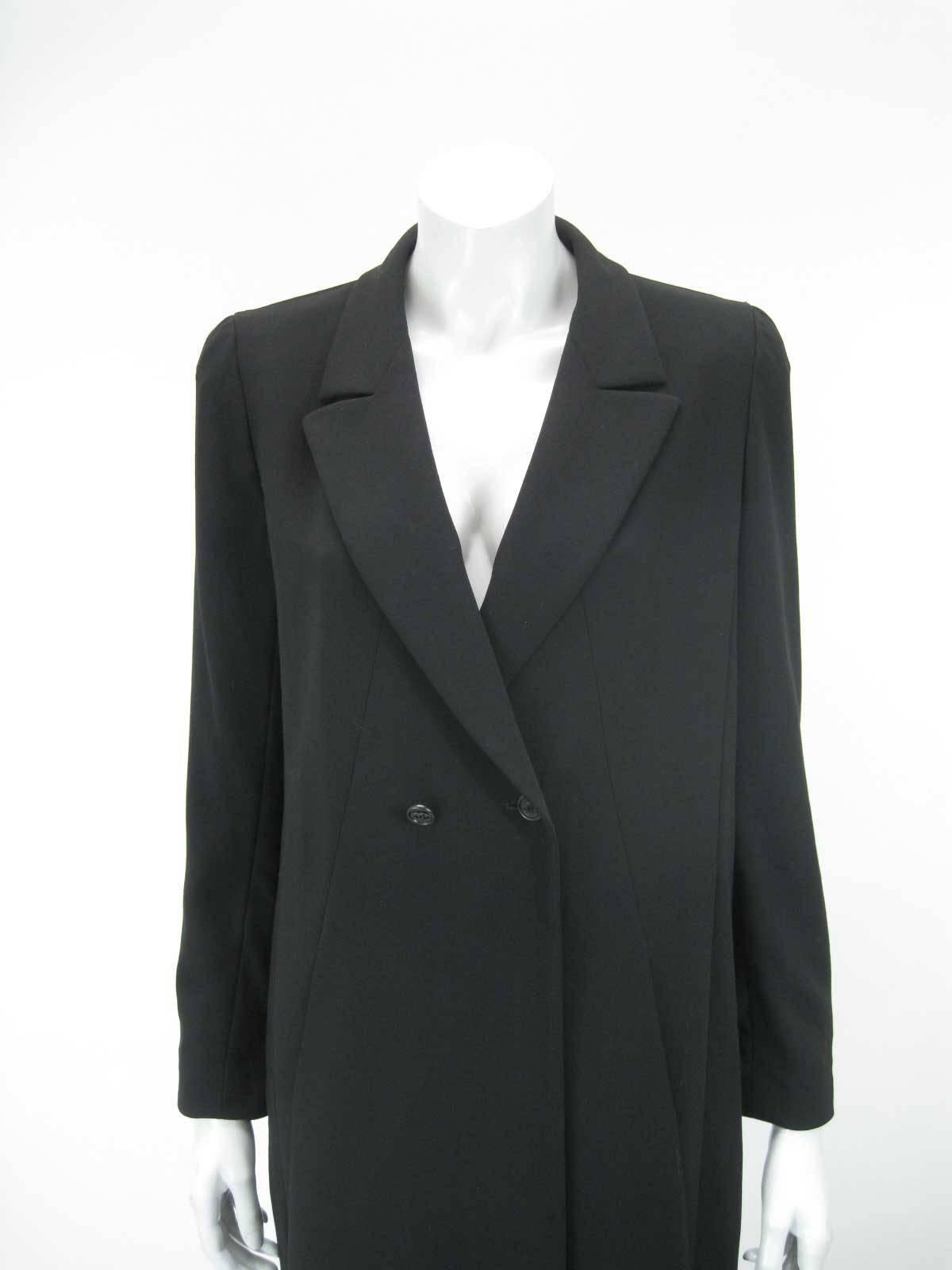 Elegant Chanel Boutique long black jacket. I believe the 98P denotes Printemps 98, or Spring 1998.

Suit tailoring with low neckline.

Double breasted with CC button closure and one hidden closure.

Flattering seaming with side pockets.

Fully lined