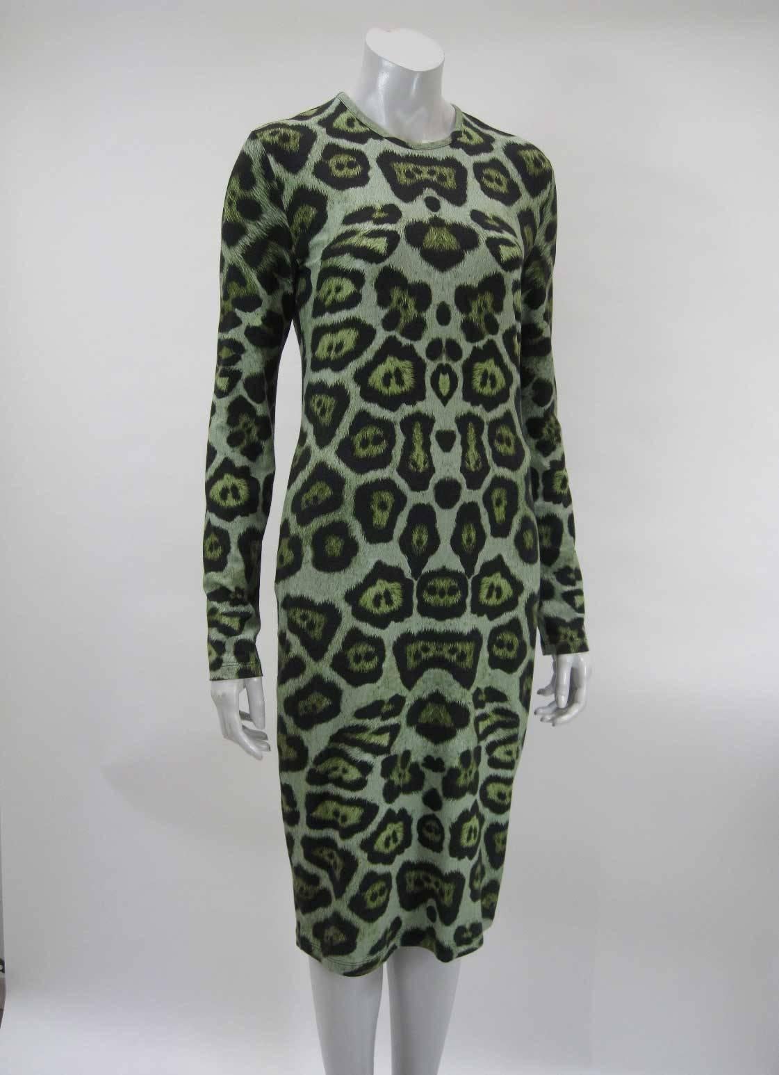 Stunning Givenchy jersey leopard print dress.

Vibrant hues and green and blue-green and black.

Sheath shape.

Body hugging with ample stretch.

Back zipper.

Long sleeves.

Tagged size 44.

Fabric is viscose, elastane. Lining/finishing fabric is
