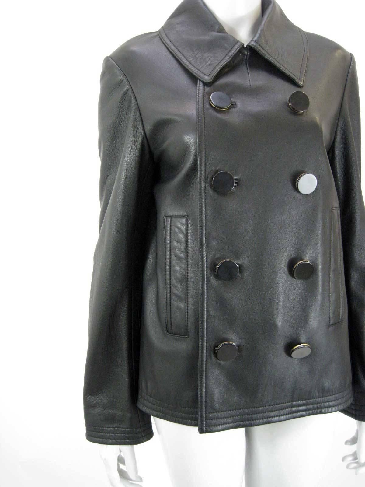 Balenciaga classic black leather jacket.

Soft buttery leather.

Double breasted with black & gold disk buttons. 

Front slit pockets.

Fully lined.

Back slit.

Tagged size 40.

This is in excellent pre-owned condition with no holes, stains or