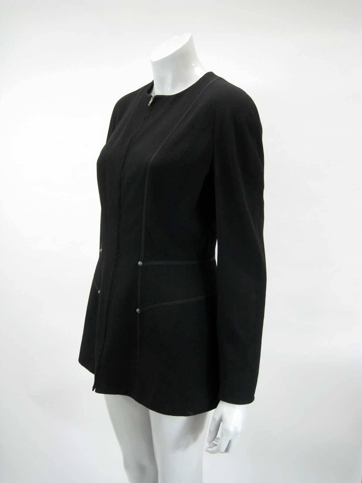 Vintage Claude Montana jacket in what feels like wool, zip front with black trim, decorative studs and three metal cuff buttons.

Made in Italy.

The jacket is in good vintage condition with no structural defects or stains.

The jacket is tagged