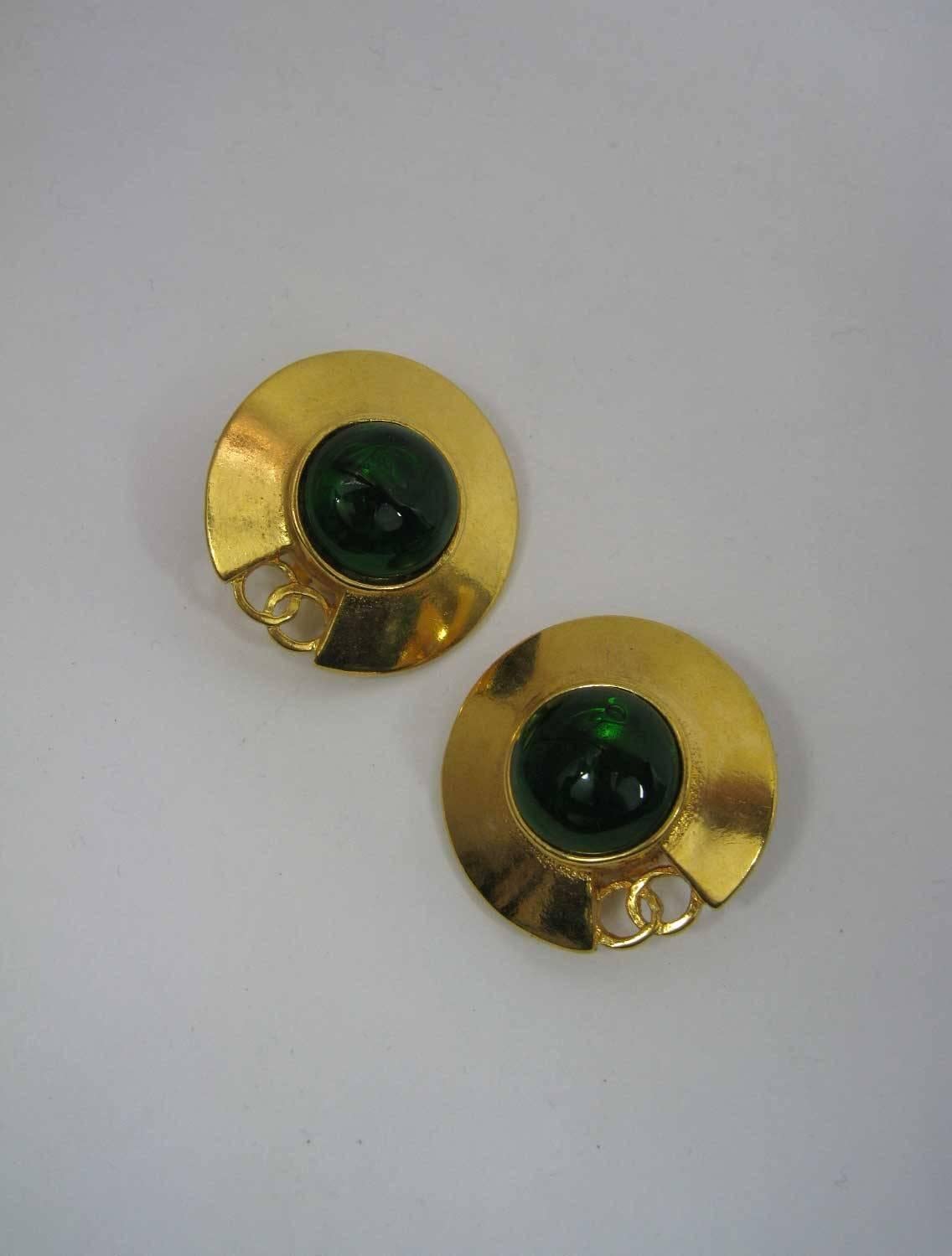 1980's Chanel gold-tone saucer shaped earrings.

CC design with large green glass 