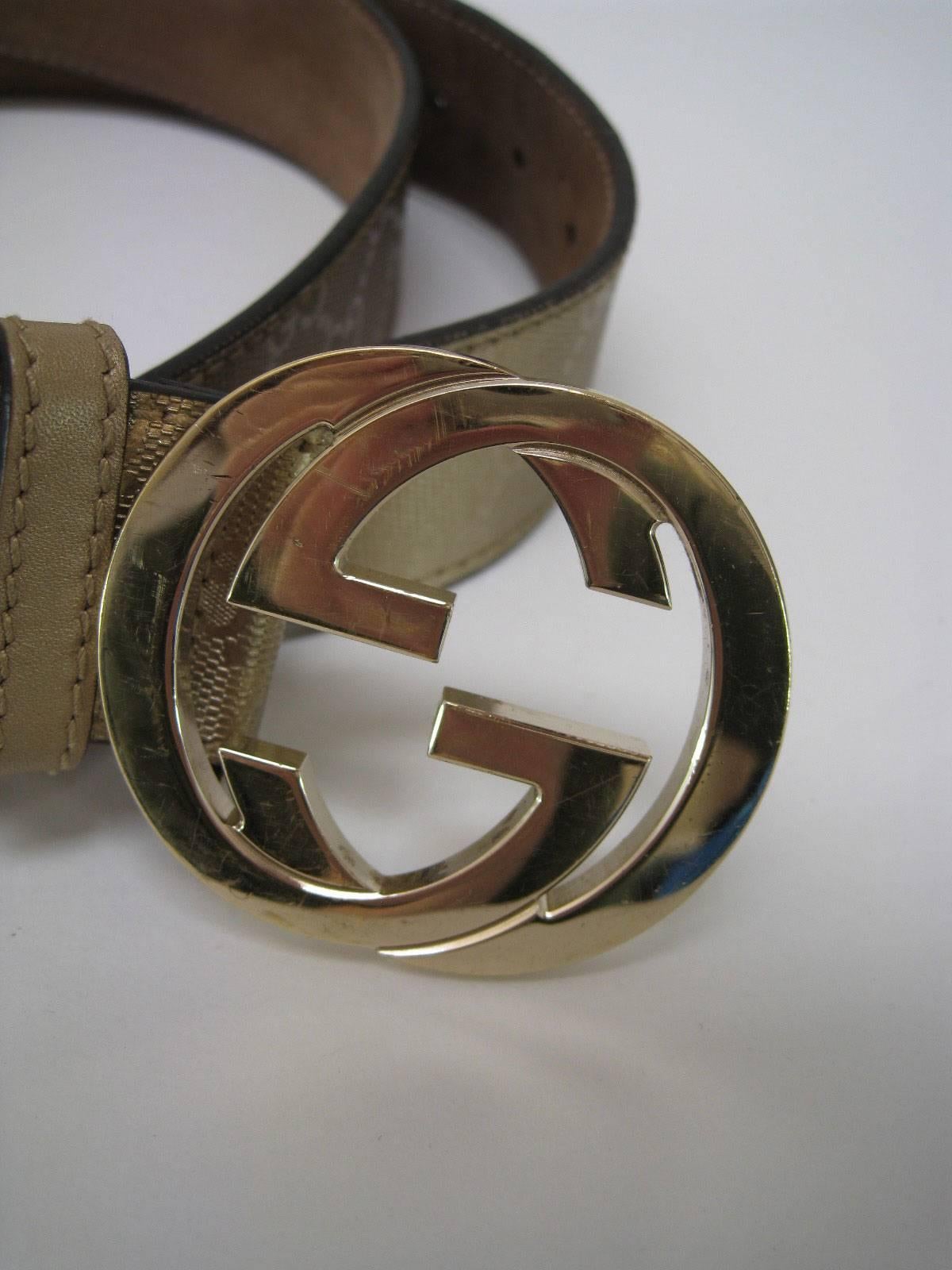 Gucci Guccissima gold metallic leather belt with G buckle.

Interlocking G buckle.

Textured all over with Gucci logo imprint.

Gucci stamp and number inside.

Labeled size 40.

Made in Italy.

This item is in good pre-owned condition with some wear