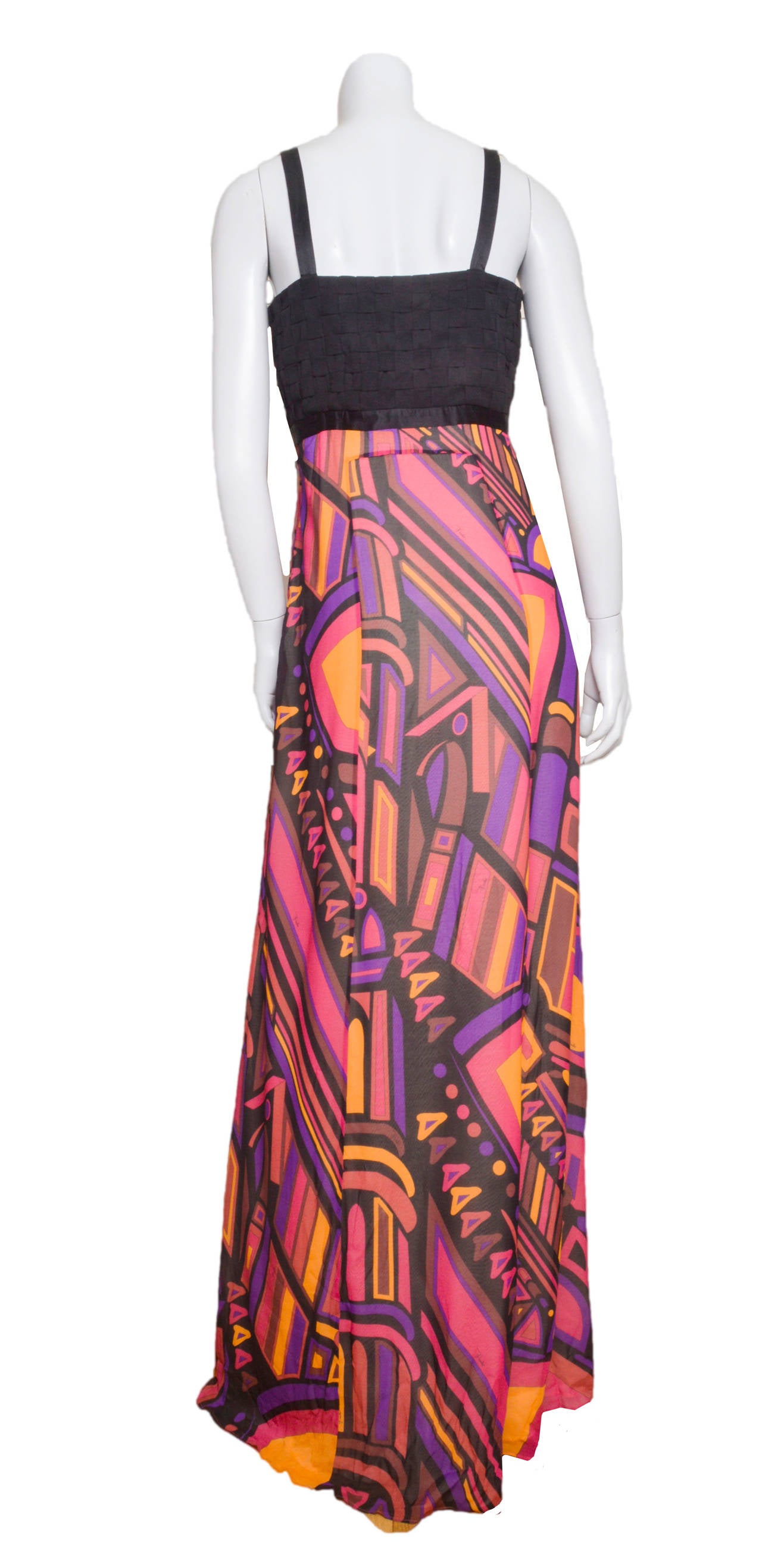 Stunning empire waist silk crepe Emilio Pucci dress.
Plunging neckline with empire waist and basket weave bodice.
Jewel tone abstract print a-line skirt.
Skirt is lined.
Side zip with hook an eye closure.
Tagged a size 40.