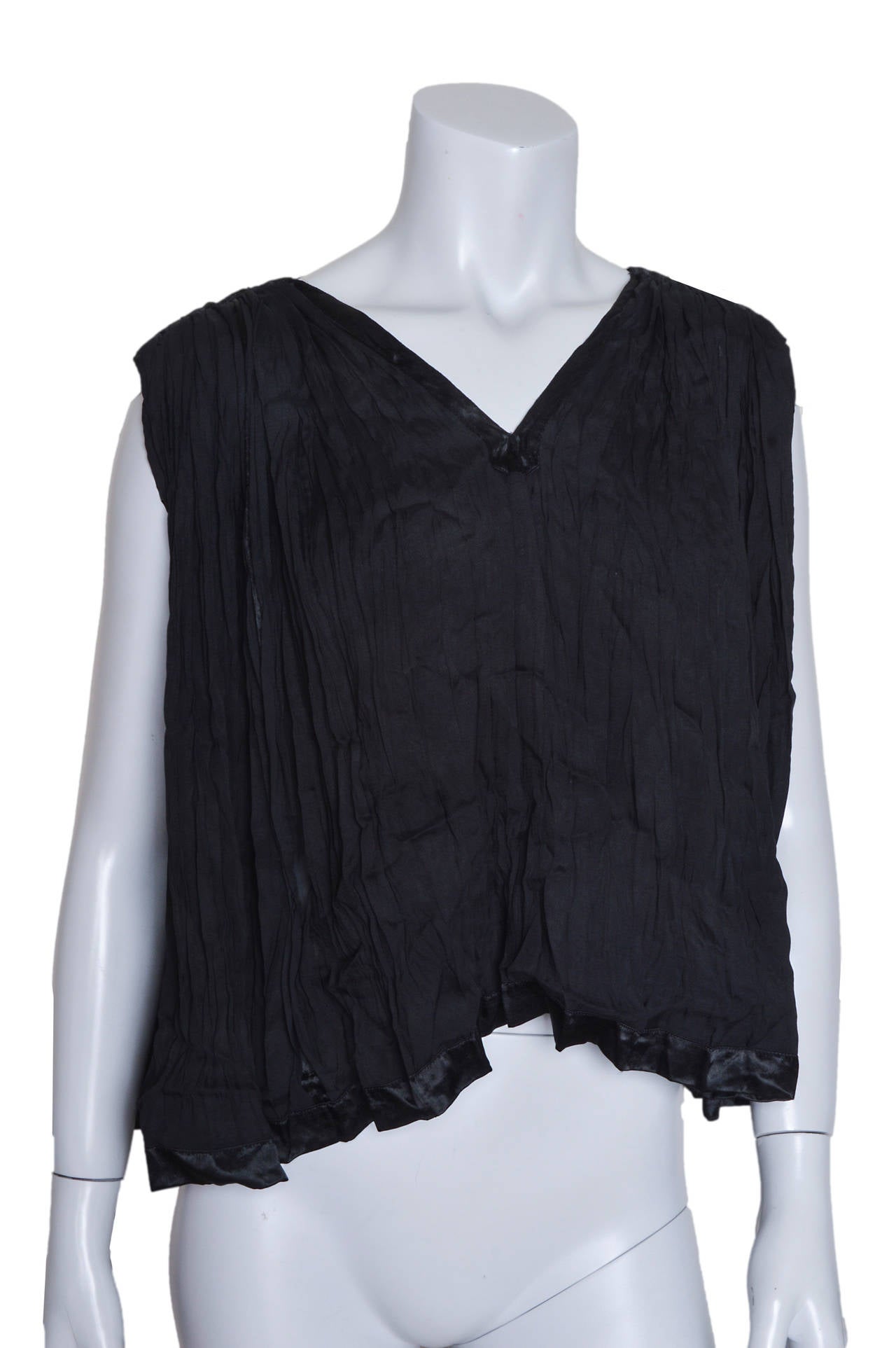 Elegant Issey Miyake black top and skirt set.
Airy top with pleating and alternating panels of sheer fabric.
V neck, sleeveless, very loose shape. 
Long skirt is pleated with same sheer panels.
Side button closure.
Luxurious satiny