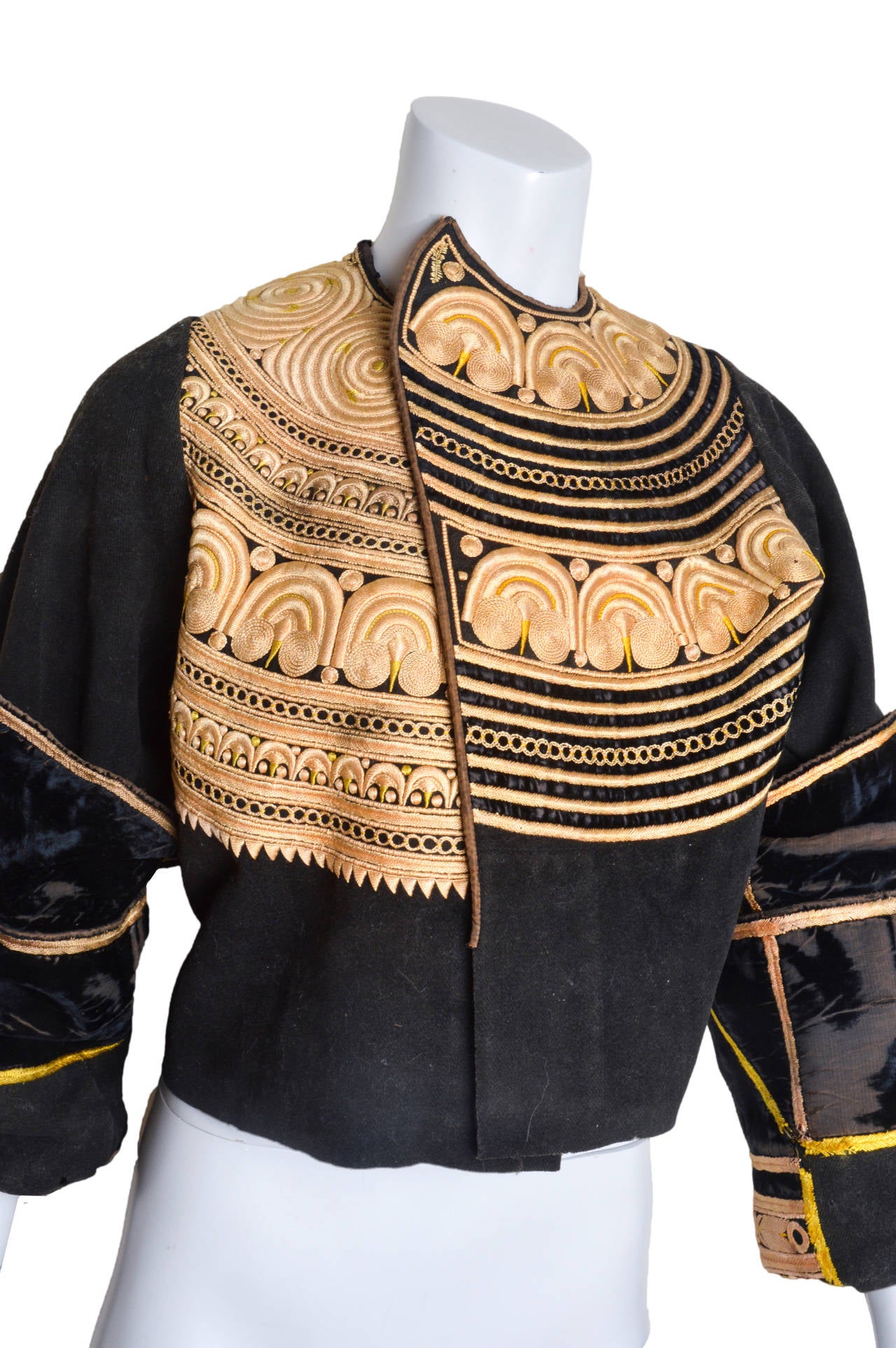 Truly of work of art and great care.
Very early, exact age and origin unknown.
Perhaps Edwardian? Late 1800's-early 1900's.
Possibly military regalia.
Black wool, hand stitched and hand embroidered.
Intricate and very precise gold