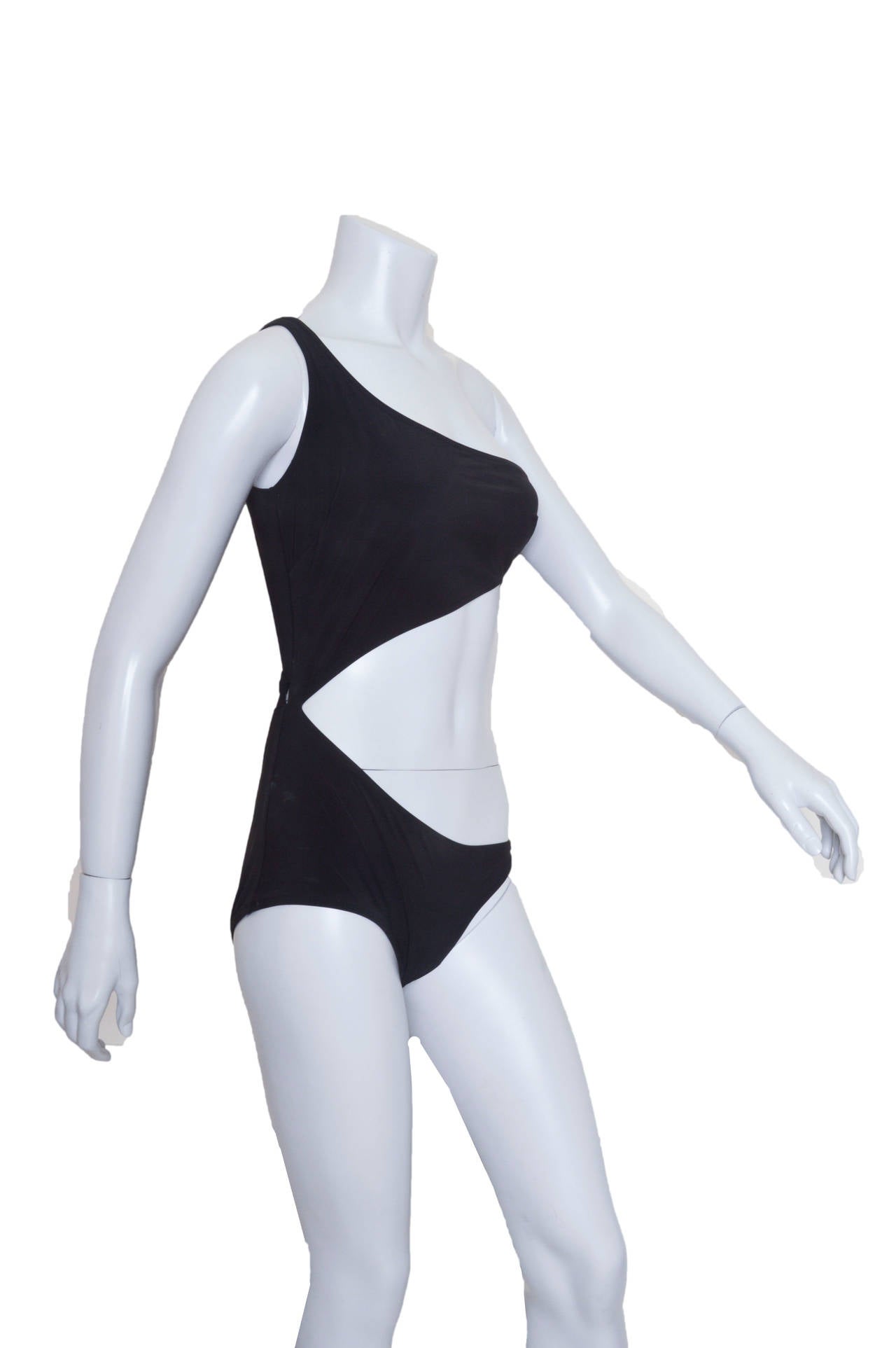 Insanely sexy Gucci 2011 swim suit.
Black one-shoulder swimsuit with cutout waist. 
Single shoulder strap, bandeau top with side boning
which joins the briefs at one side.
Fully lined.
Tagged a size Small.