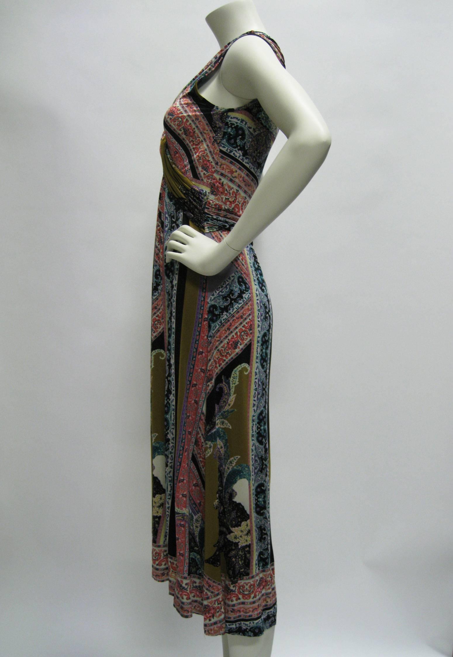 Stretchy Etro printed dress.
Slinky lightweight fabric.
Twisted empire waist.
Deep V neck.
Detailed floral motif with bold swatches of color.
Long loose skirt.
Slightly longer in back.
Tagged a size 44.
Note: Dress is very stretchy. 