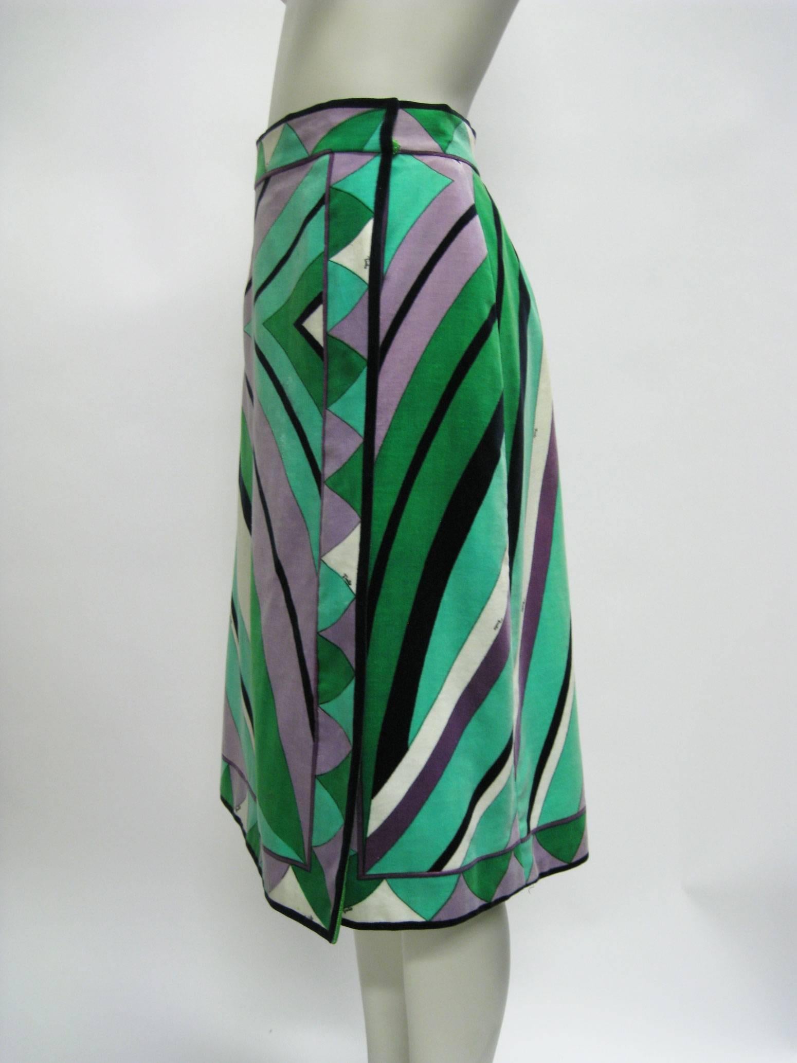 Vintage Emilio Pucci silk velvet skirt.
Wrap style.
Vibrant greens, purples, black and white geometric design.
Hidden button closure on side.
Lined.
Tagged a US vintage size 12.
