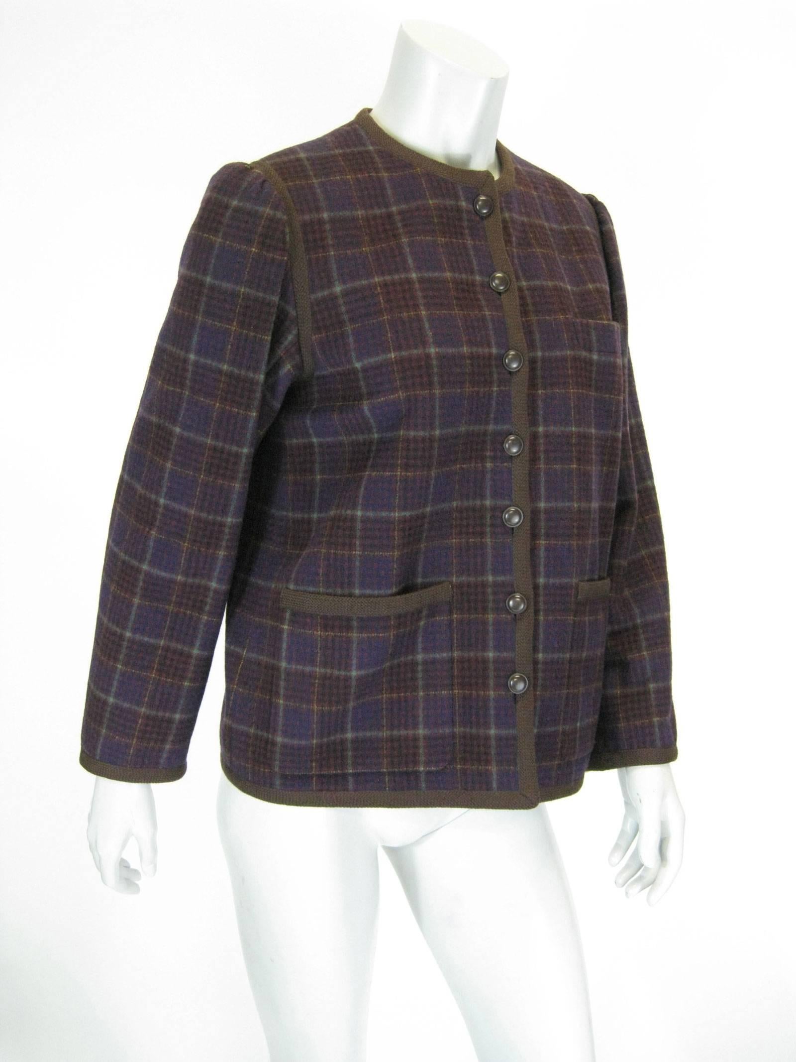 Handomse YSL Rive Gauche plaid jacket.
Trimmed in brown cording with brown buttons.
One chest pocket and two front patch pockets.
Gathered shoulders.
Fully lined.
Tagged a size 38.