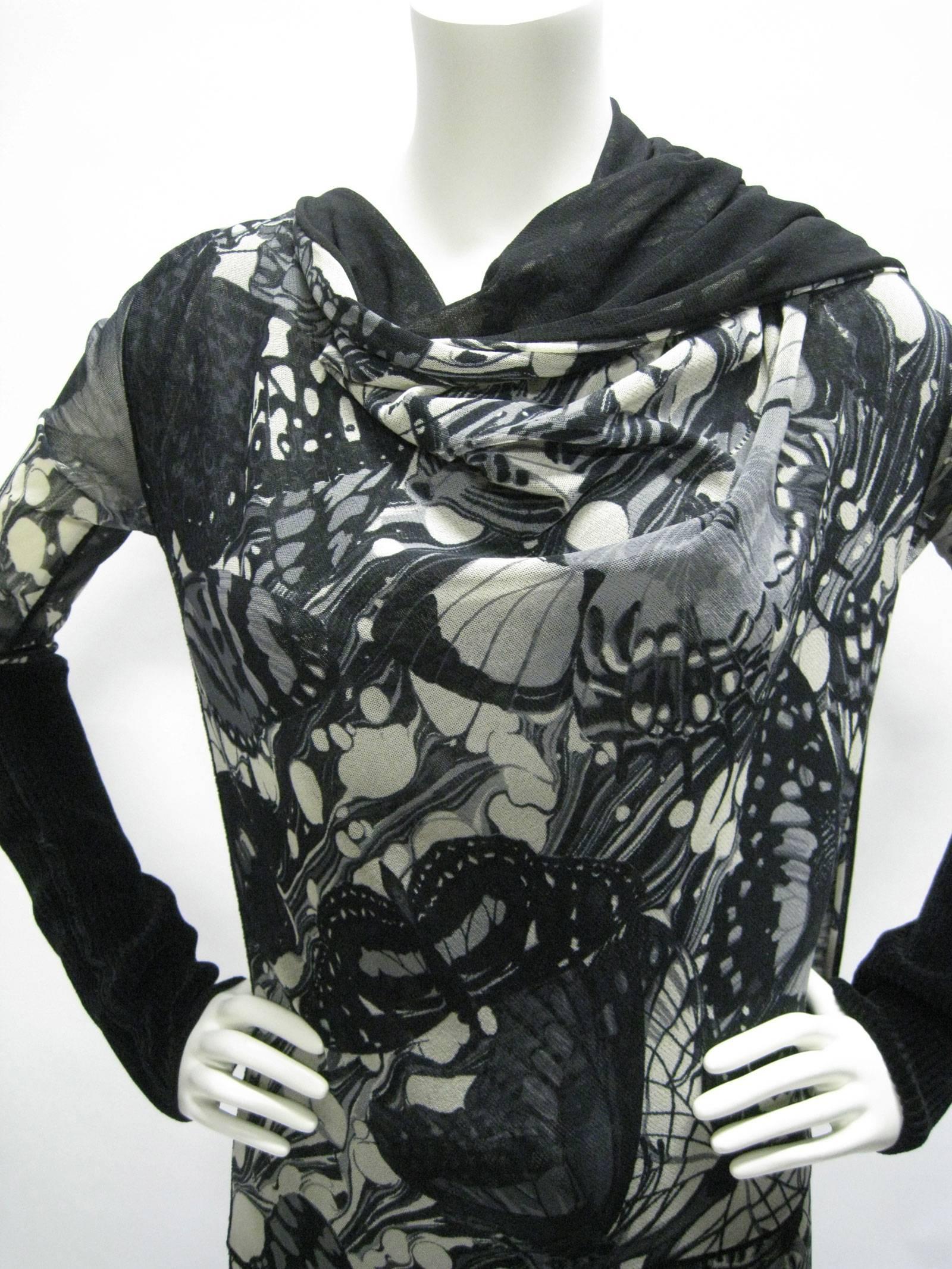 Graphic Jean Paul Gaultier Maille Femme dress.
Bold black and shades of gray abstract butterfly print.
Super stretchy double layer mesh.
Long scarf can be worn around neck or loose on back.
Asymmetrical hem with kick pleat tail.
Asymmetrical