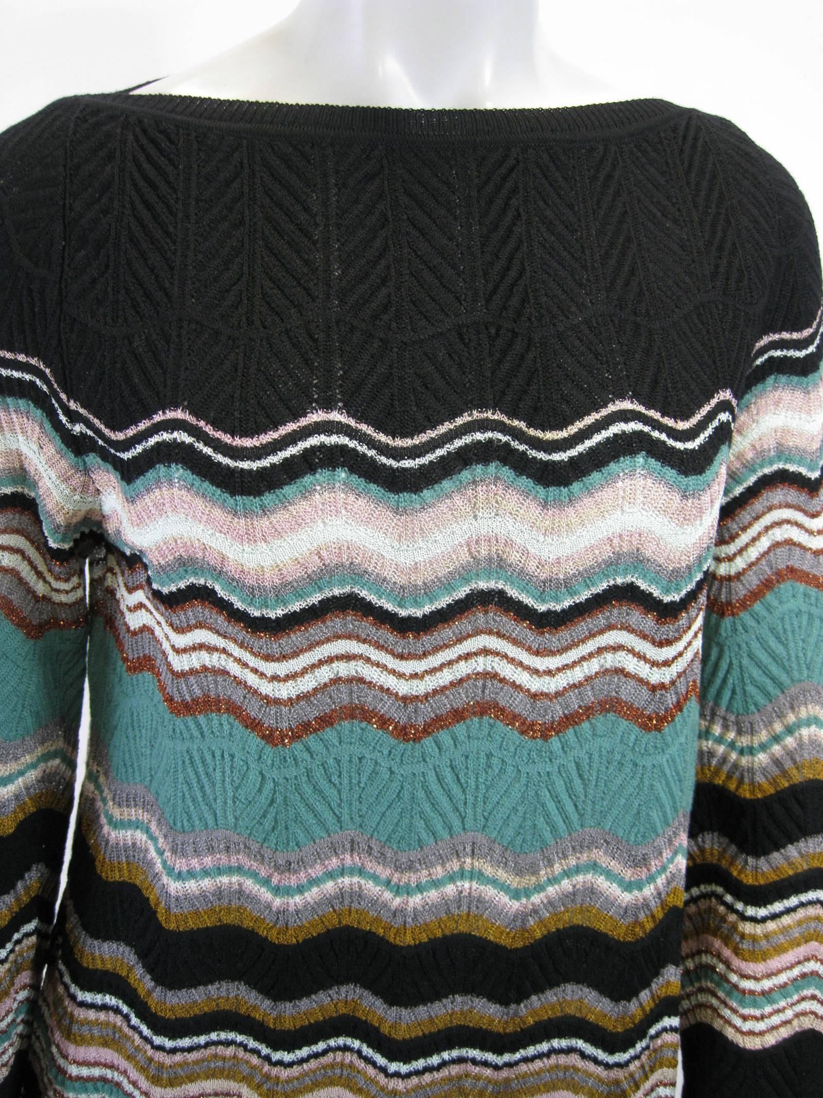 M Missoni quintessential chevron woven sweater.
Longer shape.
Boatneck.
Belled sleeves.
Lightweight, open weave.
Tagged an Italian 38/US 2.
