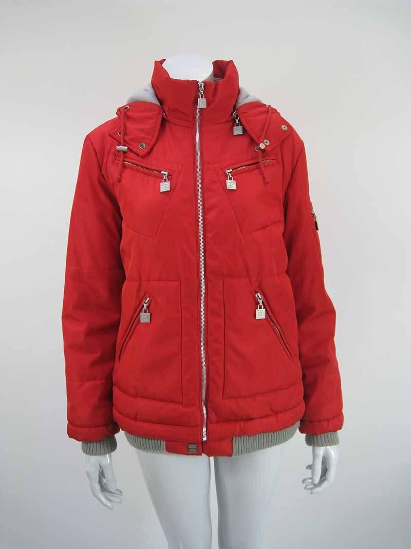 Vibrant red Chanel ski parka.

Full front zipper with silver hardware throughout.

Grey fleece lined inner neck and hood with double snap closure and cord.

CC zipper pull tabs on four front pockets.

Left arm pocket with CC patch.

Ribbed knit