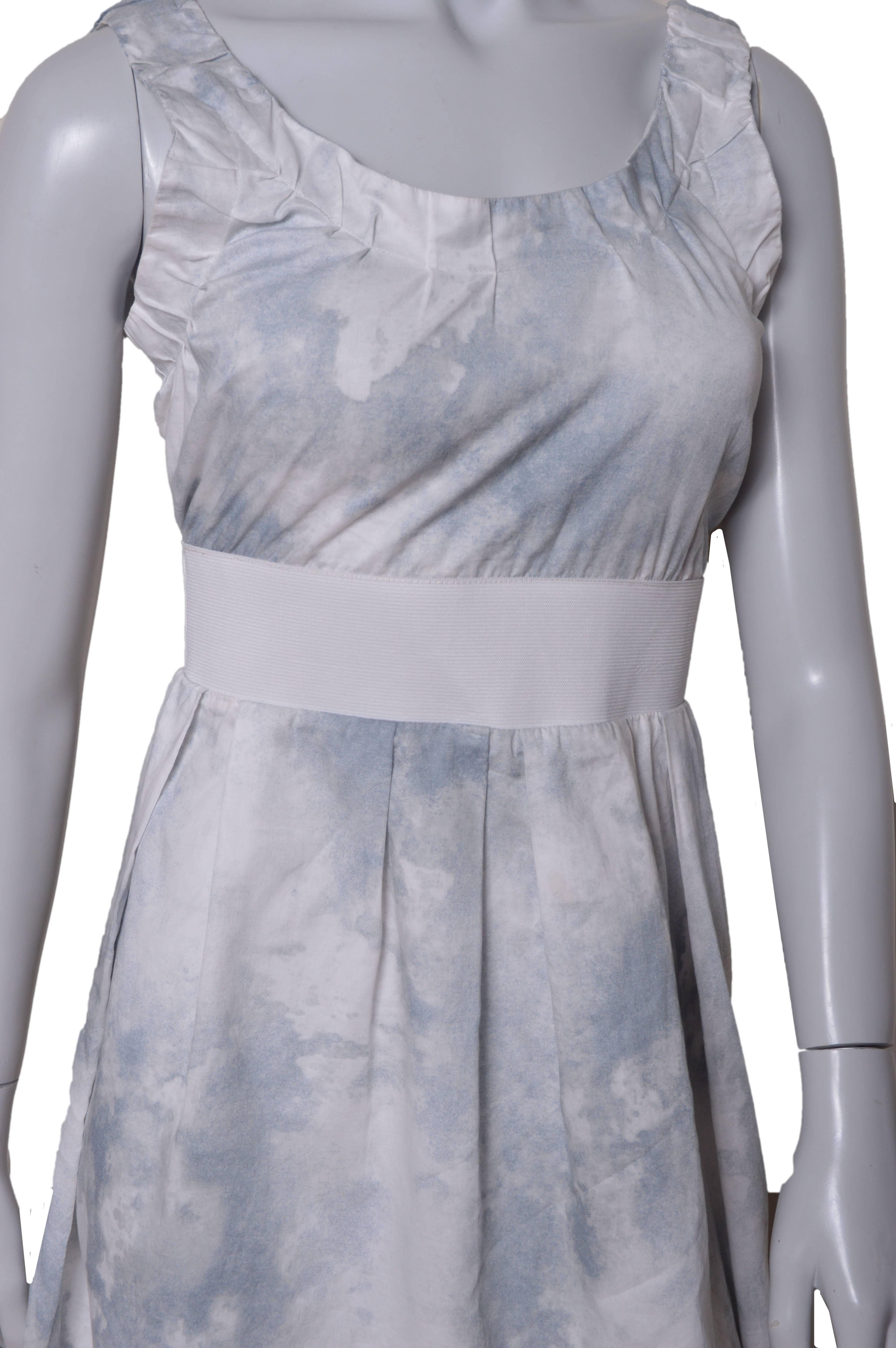 Lovely little Marni dress.
Shades of pale gray/blue on white.
Spattered watercolor effect.
Open back.
Ruched straps.
Wide white elastic waistband.
Inverted pleat skirt.
Tag size 40. Refer to measurements.