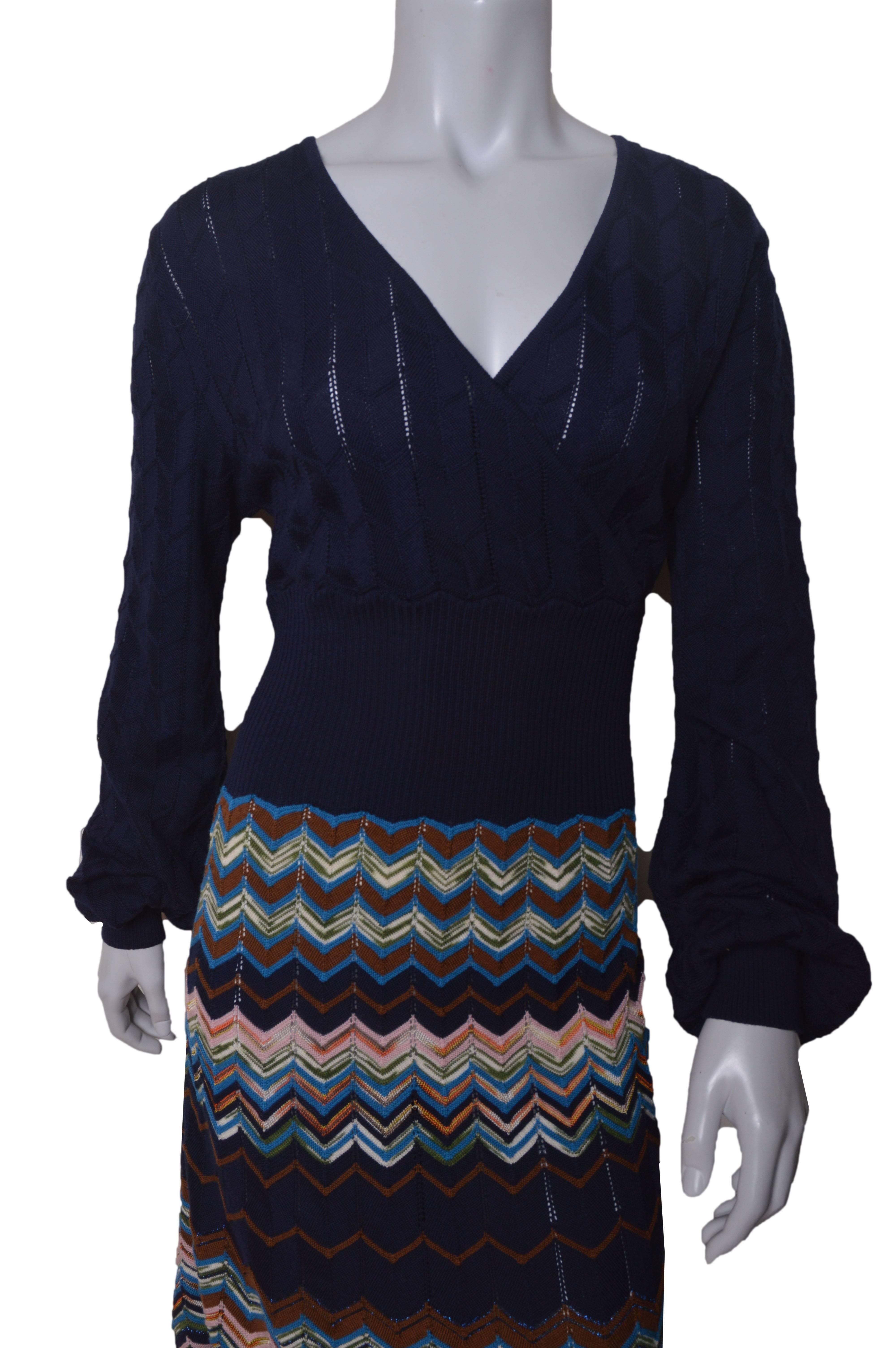 M Missoni navy blue with multicolor chevron skirt.
Pointelle knit.
Very stretchy.
Wrap neckline.
Wide ribbed waistband.
Chevron knit skirt in brown, pink, cream, green orange and metallic blue.
Skirt is lined.
Tagged a US size