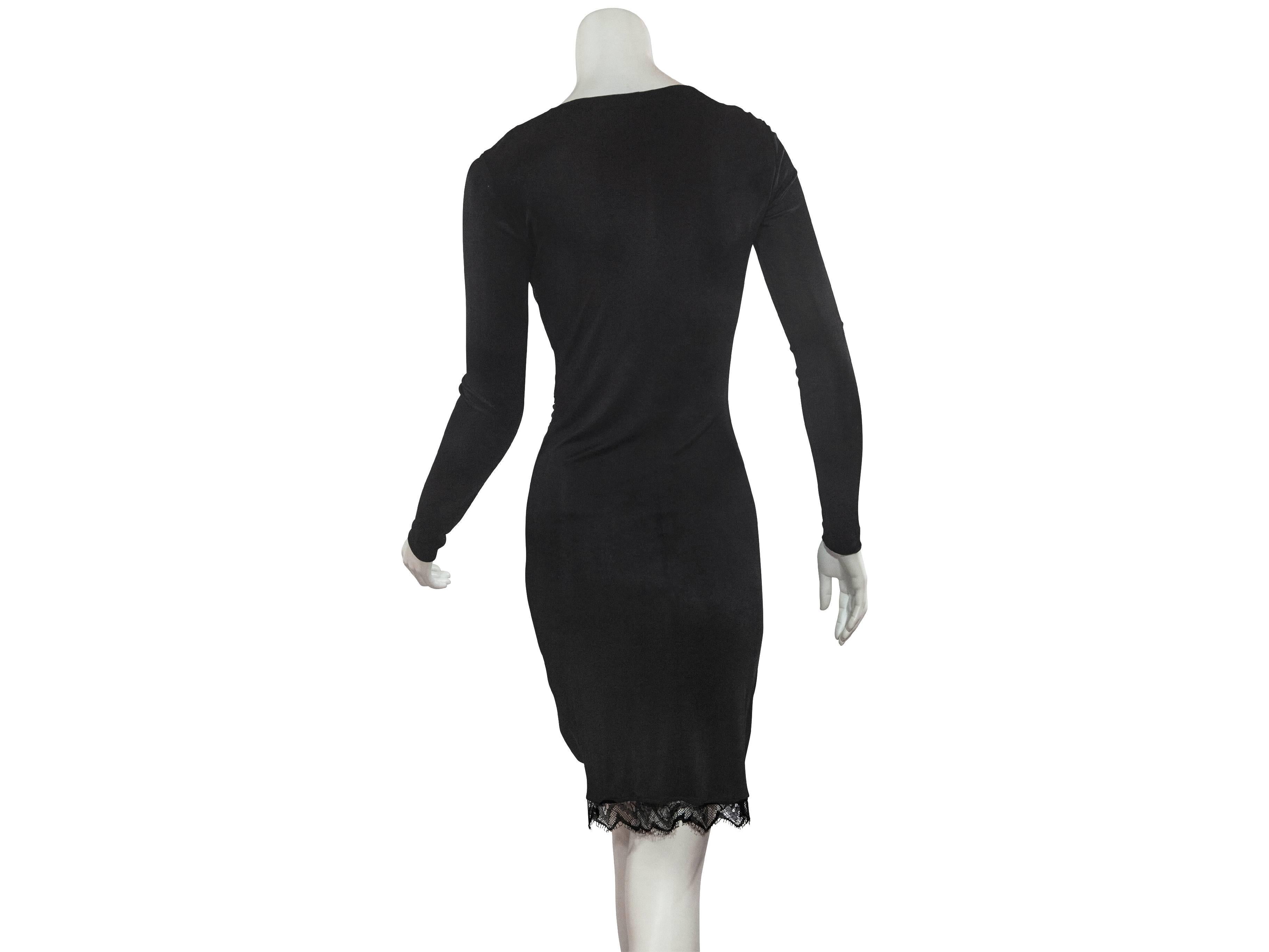 Black long-sleeve dress with flattering ruched front by Emilio Pucci.  V-neck with sheer lace inset.  Lace-trimmed hem.  Pullover style. 