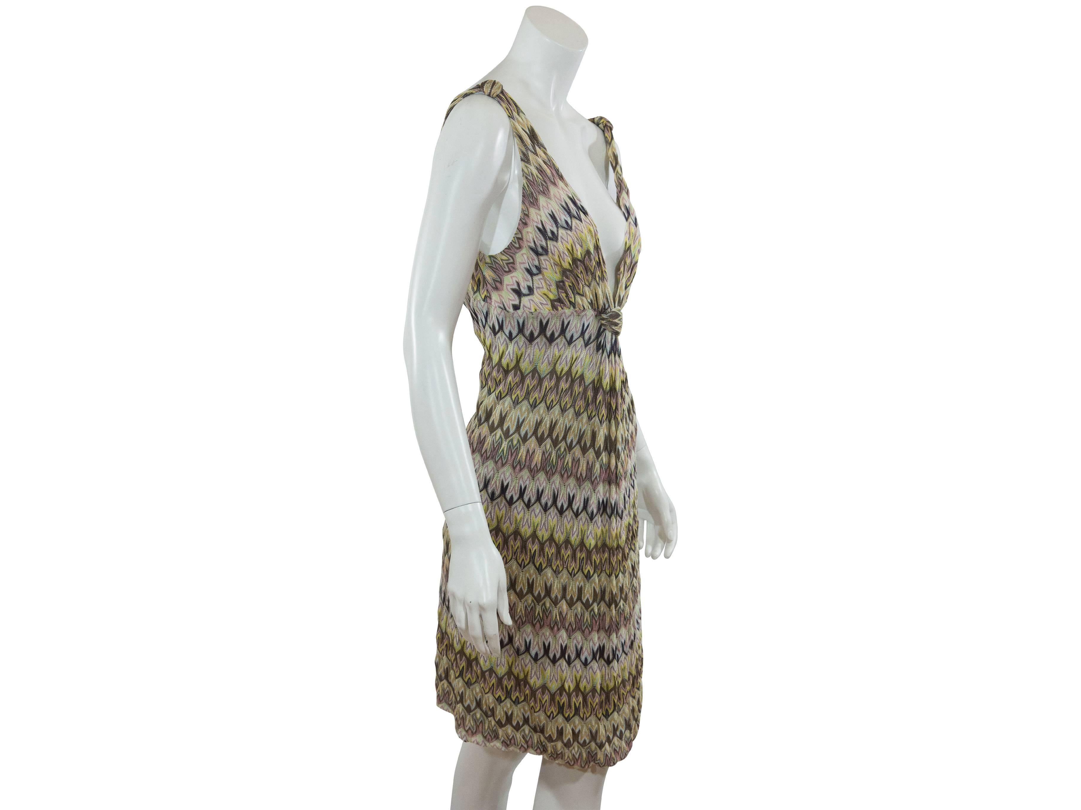 A signature multicolor knit dress by Missoni.  Plunging v-neck and back. Knotted accent at front. Pullover style.