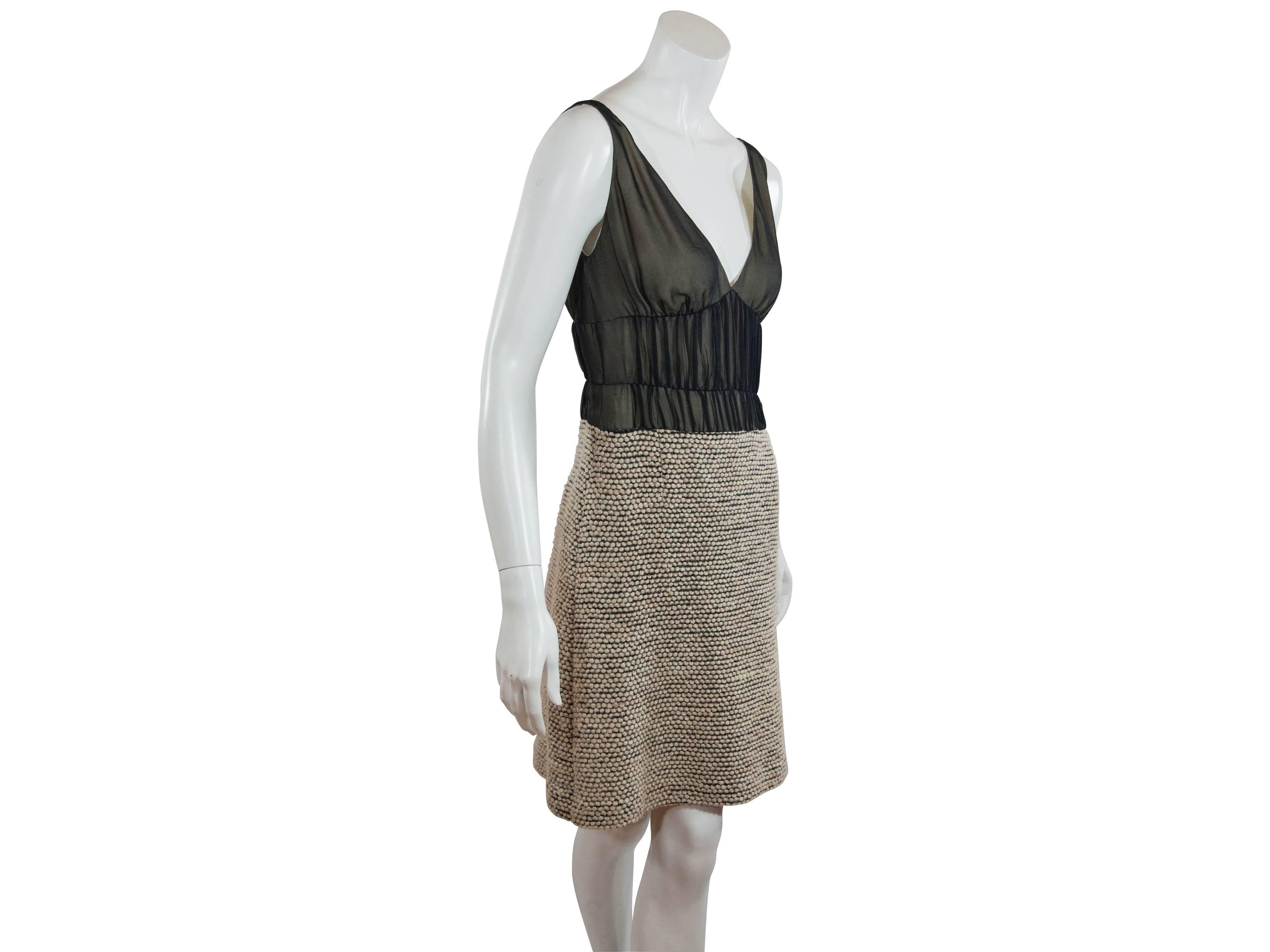 A sleeveless silk and tweed dress from J. Mendel. Double v-neck.  Shirred silk bodice and metallic-specked tweed skirting.  