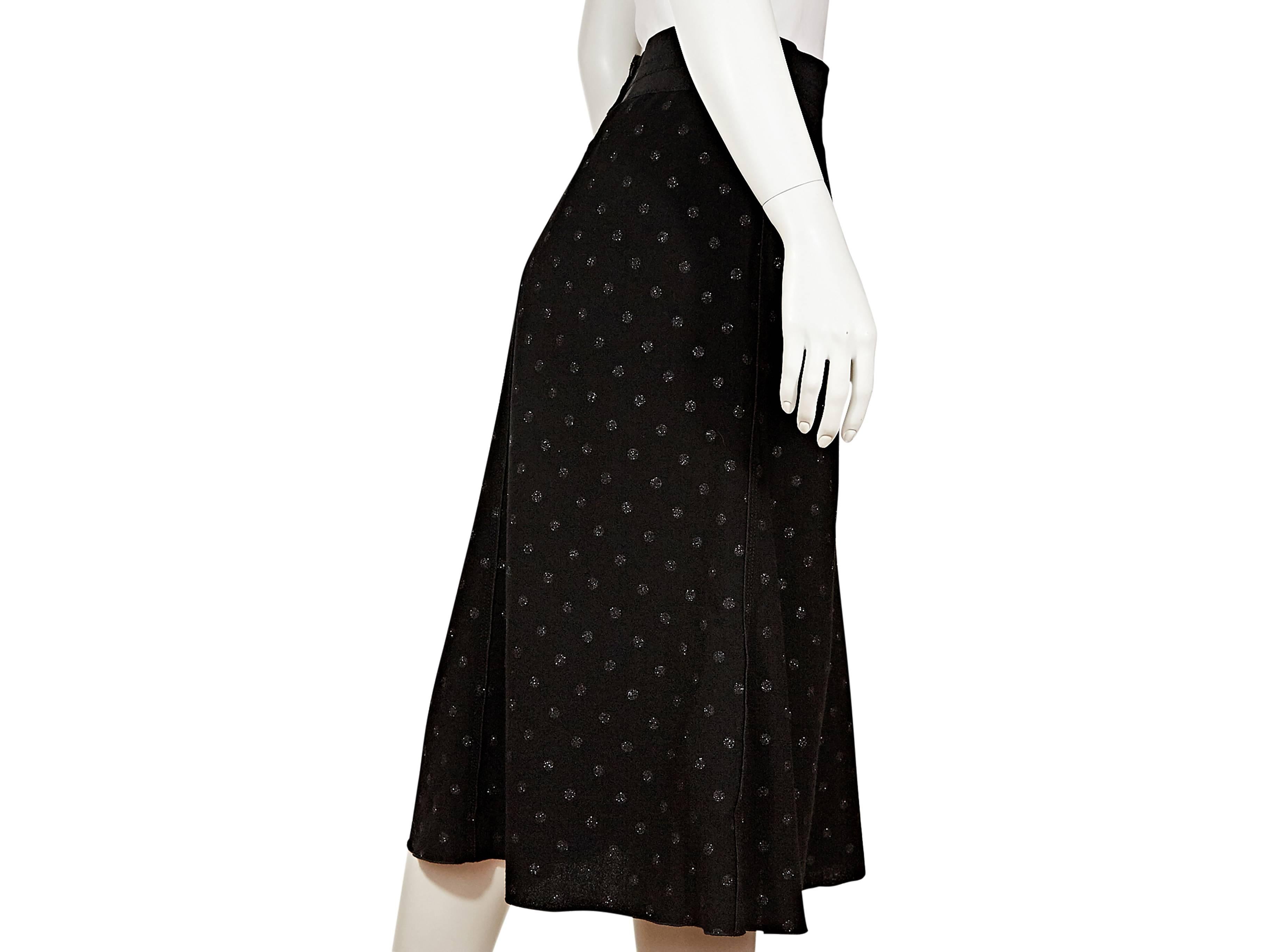 Black wool skirt embellished with polka dots by Marc Jacobs.  Wide banded waist.  Concealed back zip closure.  
