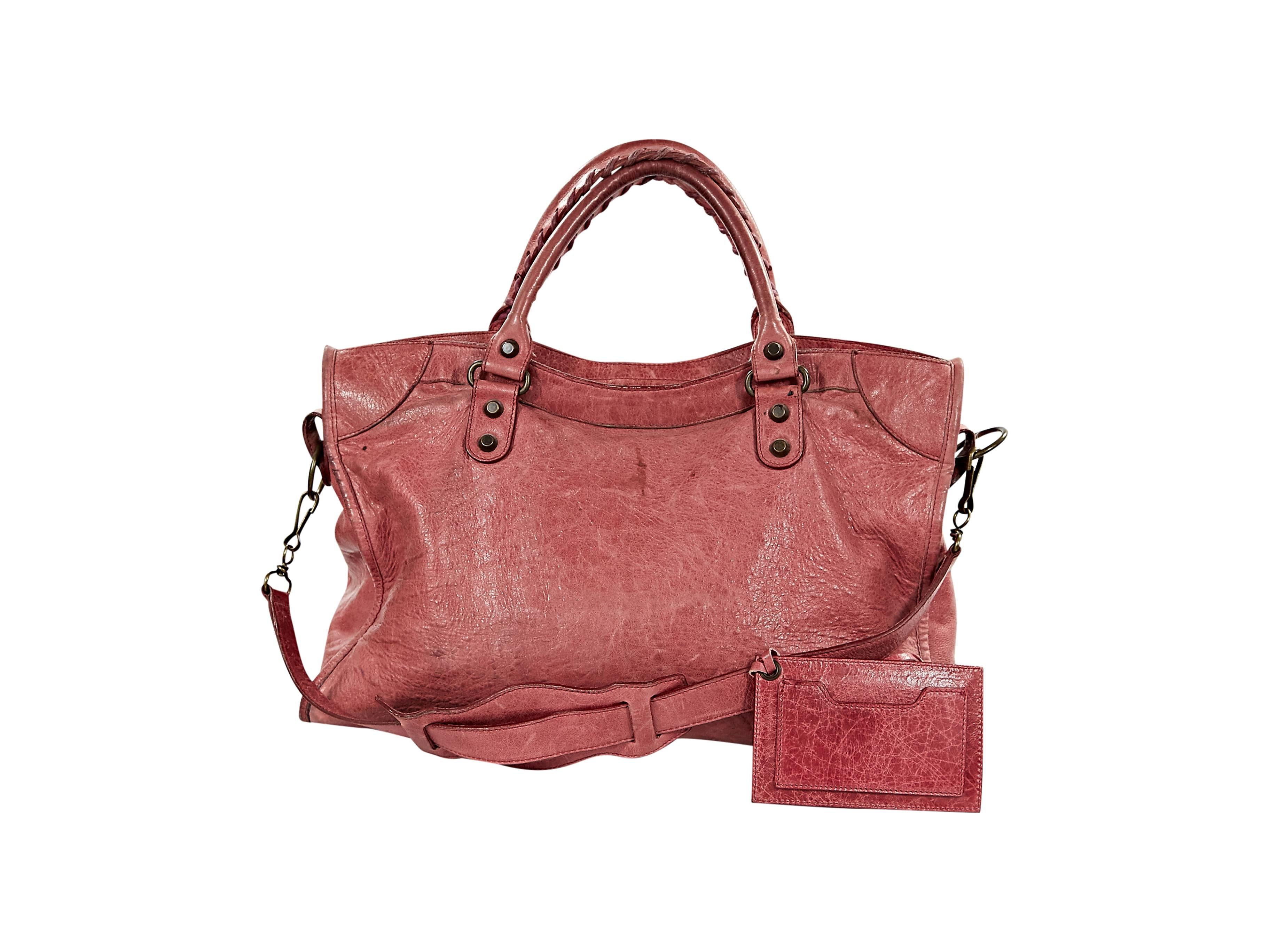 Iconic Classic City leather bag by Balenciaga.  Features attached leather framed mirror.  Double top carry handles.  Detachable crossbody strap.  Top zip closure.  Front zip pocket.  Antique goldtone hardware.  15"L x 9"H x 4"D. 
