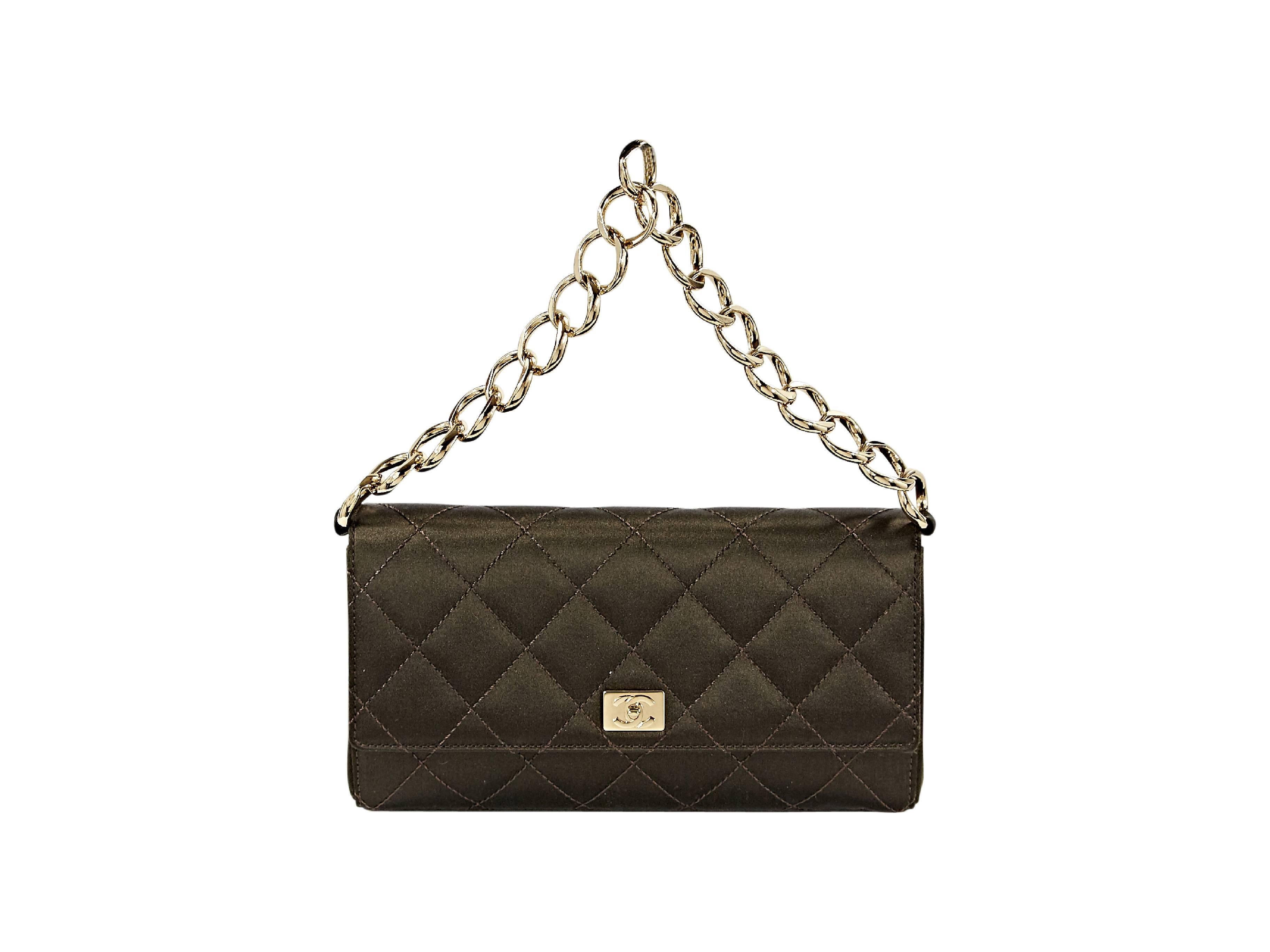 Brown quilted satin shoulder bag by Chanel.  Goldtone chain shoulder strap.  Front flap with twist-lock closure. 
