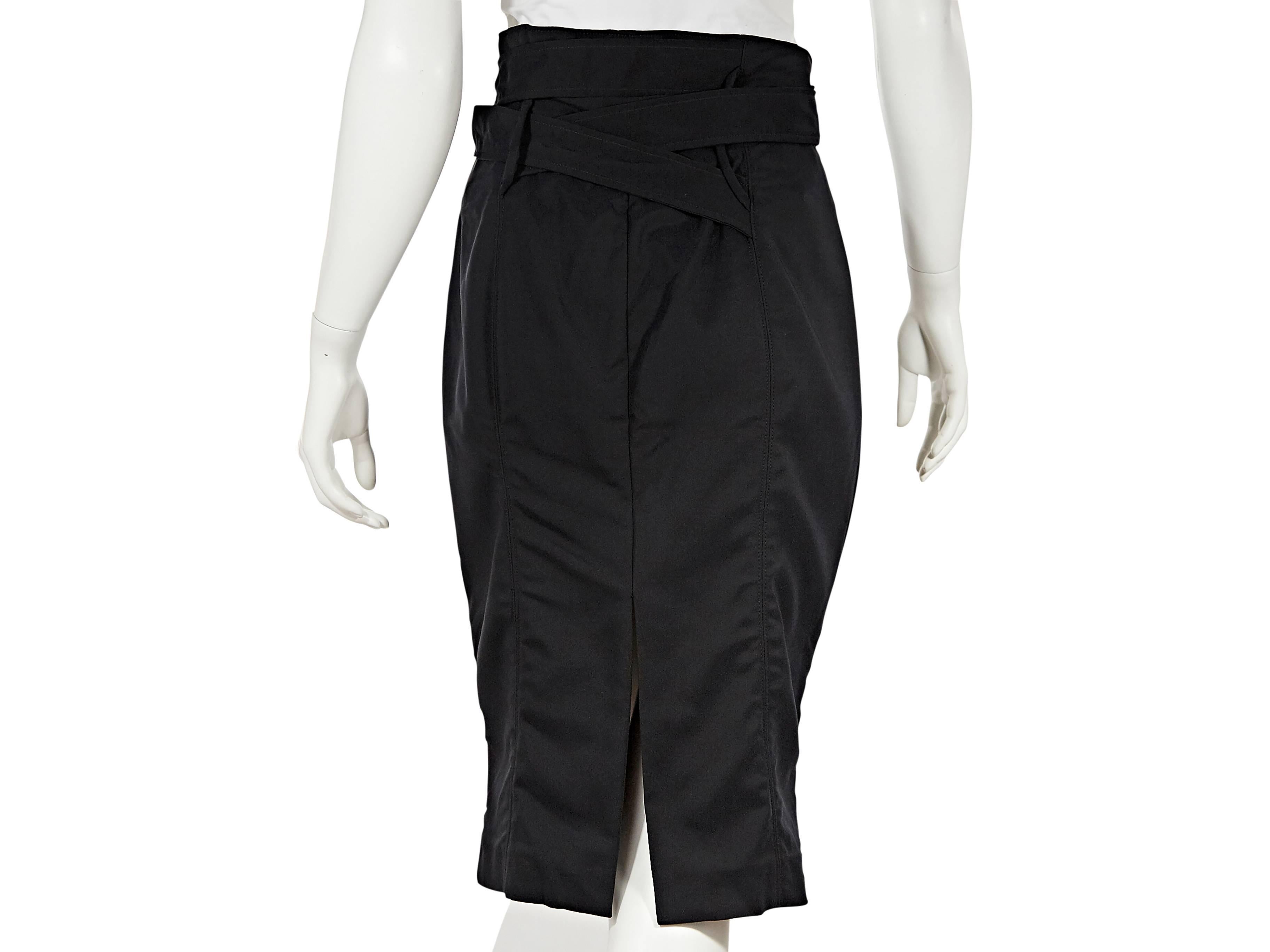 Black cotton pencil skirt by Gucci.  Wrapped belted waist.  Seams create a flattering silhouette.  Center back hem slit.  Goldtone hardware.