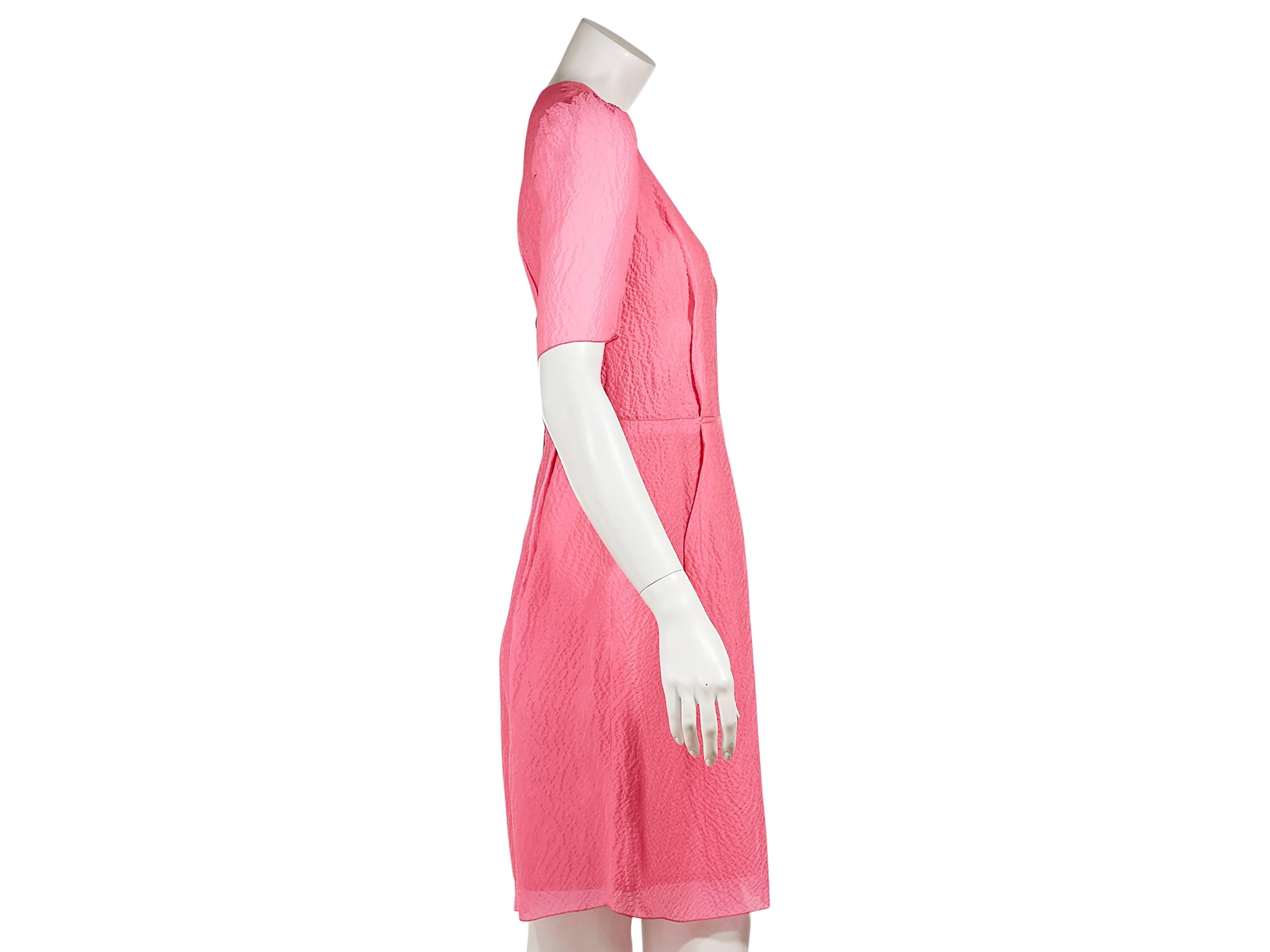 Hot pink textured silk sheath dress by Lanvin.  Crewneck.  Elbow-length sleeves.  Dart seams create a flattering silhouette. Exposed back zip closure. 