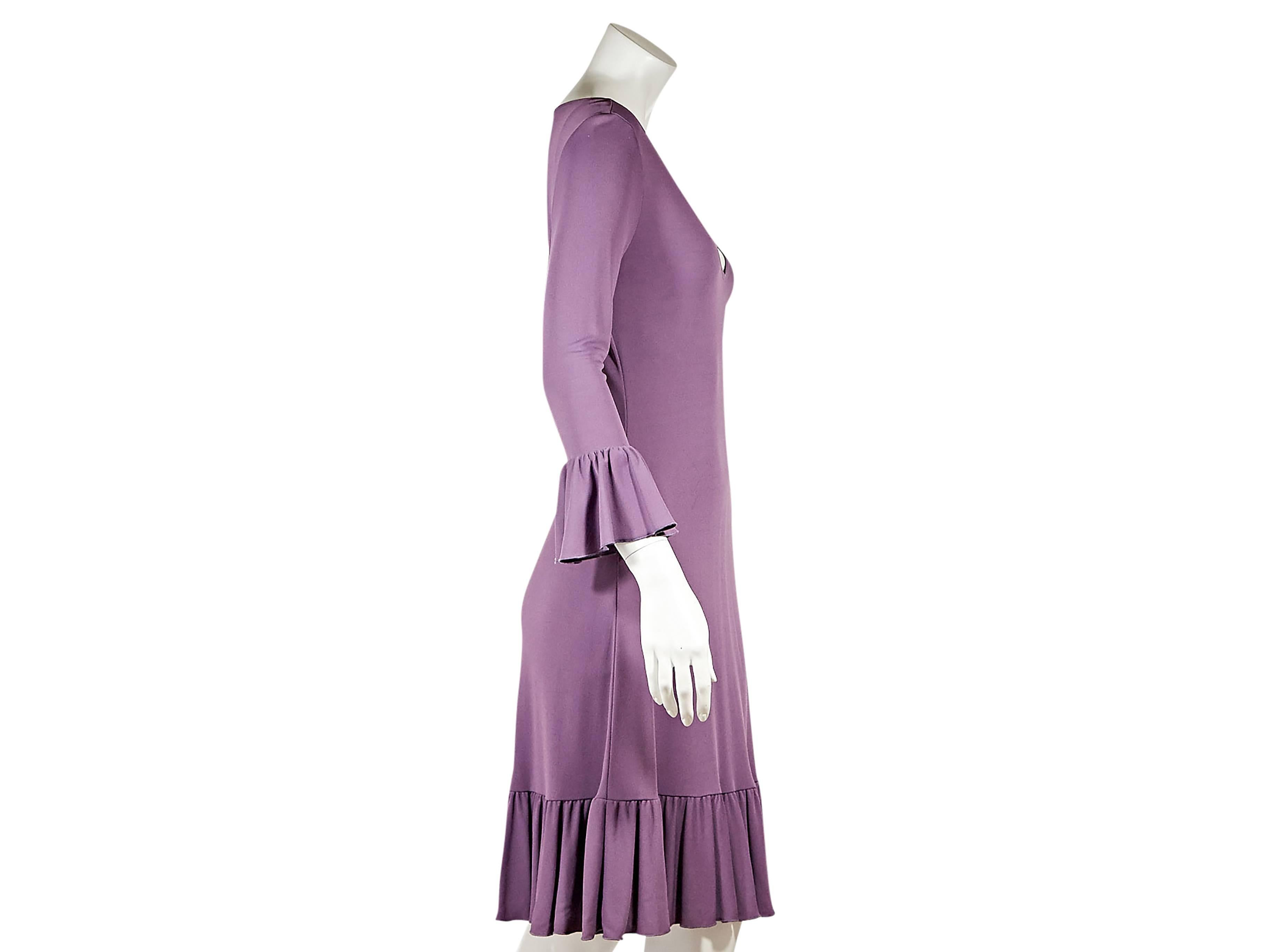 Purple shift dress by Celine.  Deep v-neck.  Three-quarter length sleeves.  Ruffle cuffs and hem.  Pullover style.    