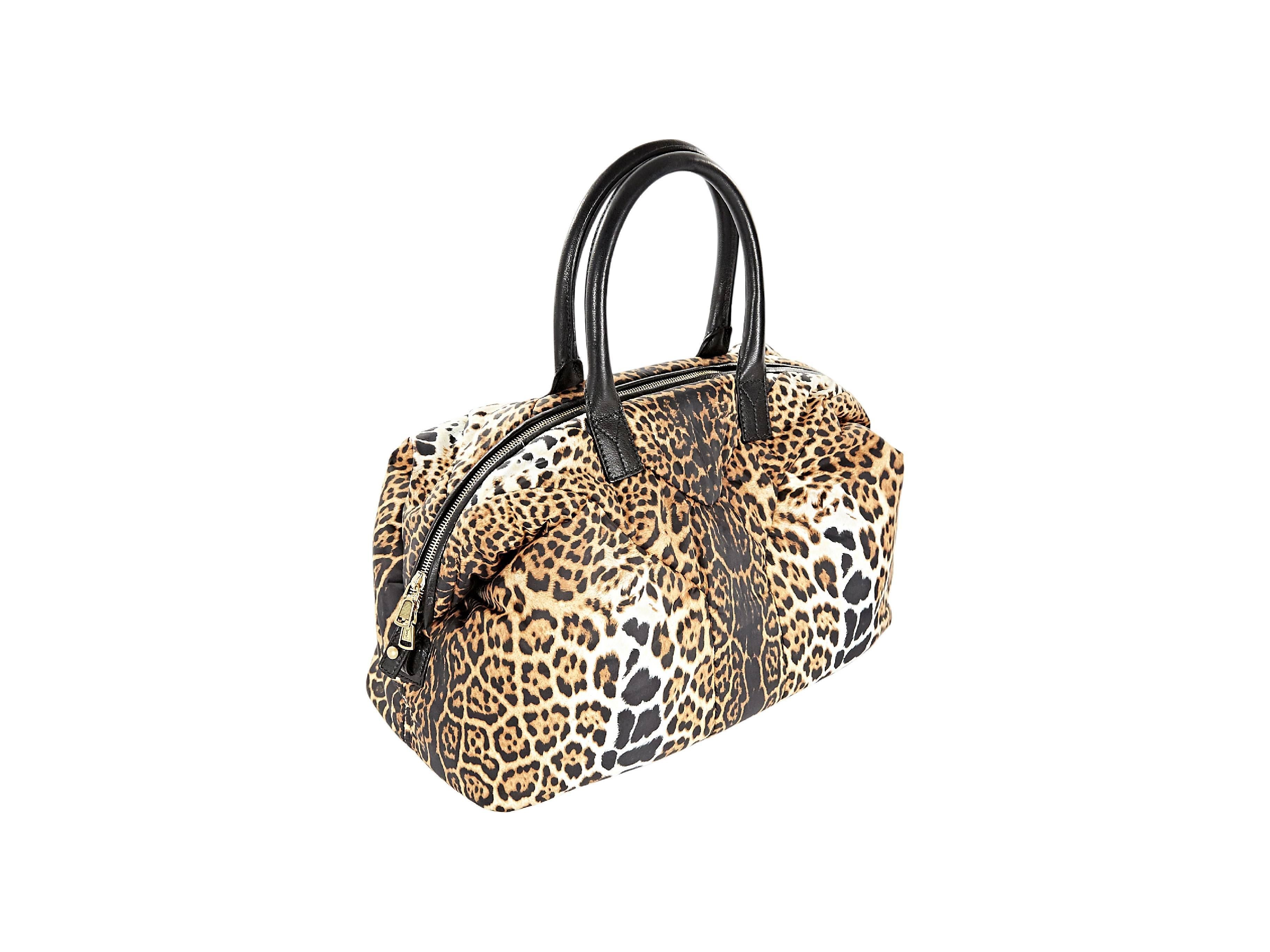 Leopard-print handbag by Yves Saint Laurent.  Dual carry handles.  Top zip closure.  Protective metal feet.  