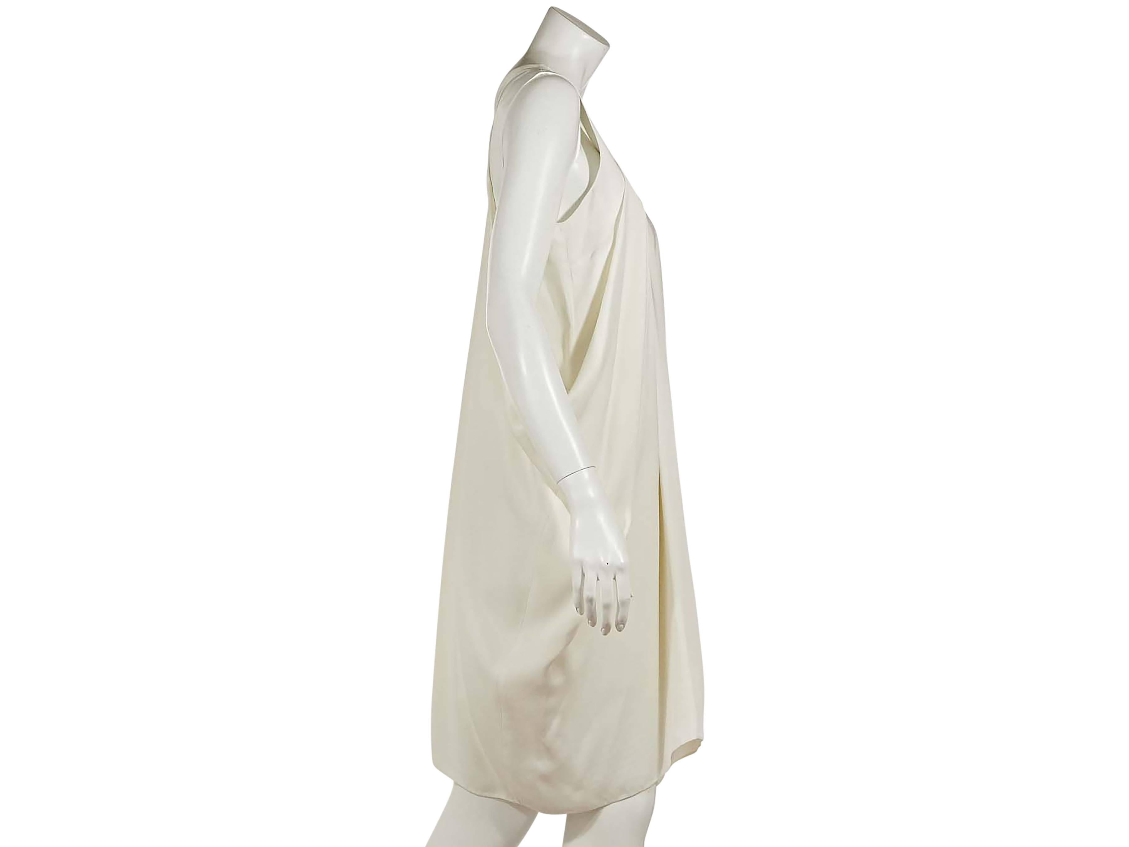 White viscose layered dress by Proenza Schouler.  Double v-neck.  Sleeveless.  Cutout straps.  Asymmetrical hem. 