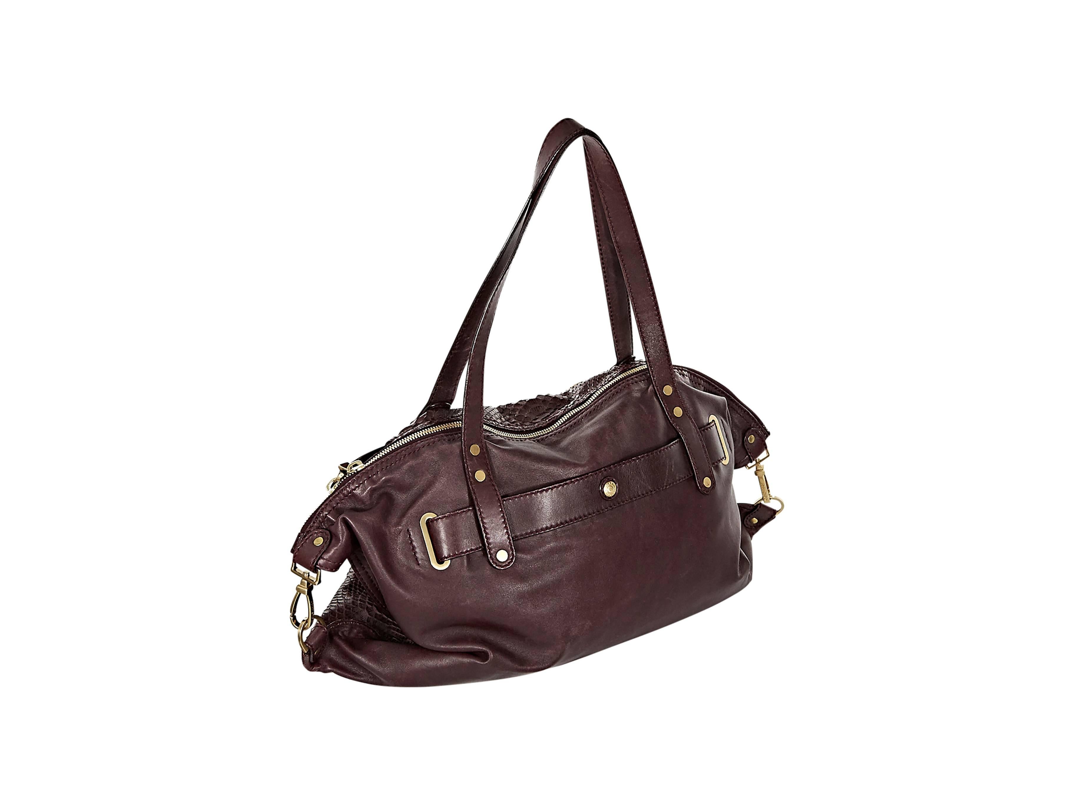 Purple python satchel by Jimmy Choo.  Double shoulder straps.  Top zip closure.  Side buckle details.  Lined interior with inner pockets.  Goldtone hardware. 