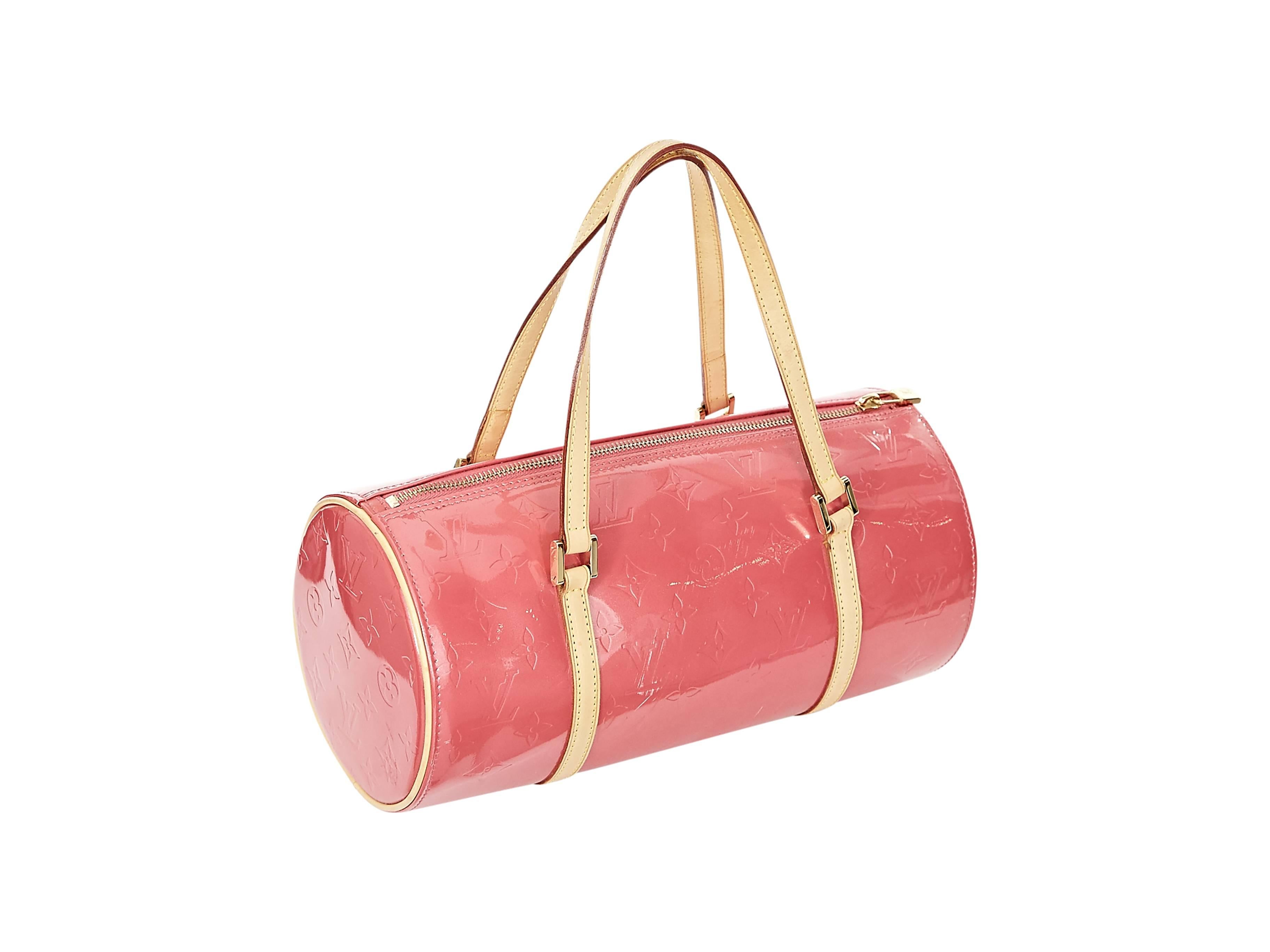Pink patent leather monogrammed barrel 'Papillon' by Louis Vuitton.  Tan leather shoulder straps.  Top zip closure with lock.  Goldtone hardware. Handle Drop 6”, Height 6”, Width 12”, Depth 5.5”