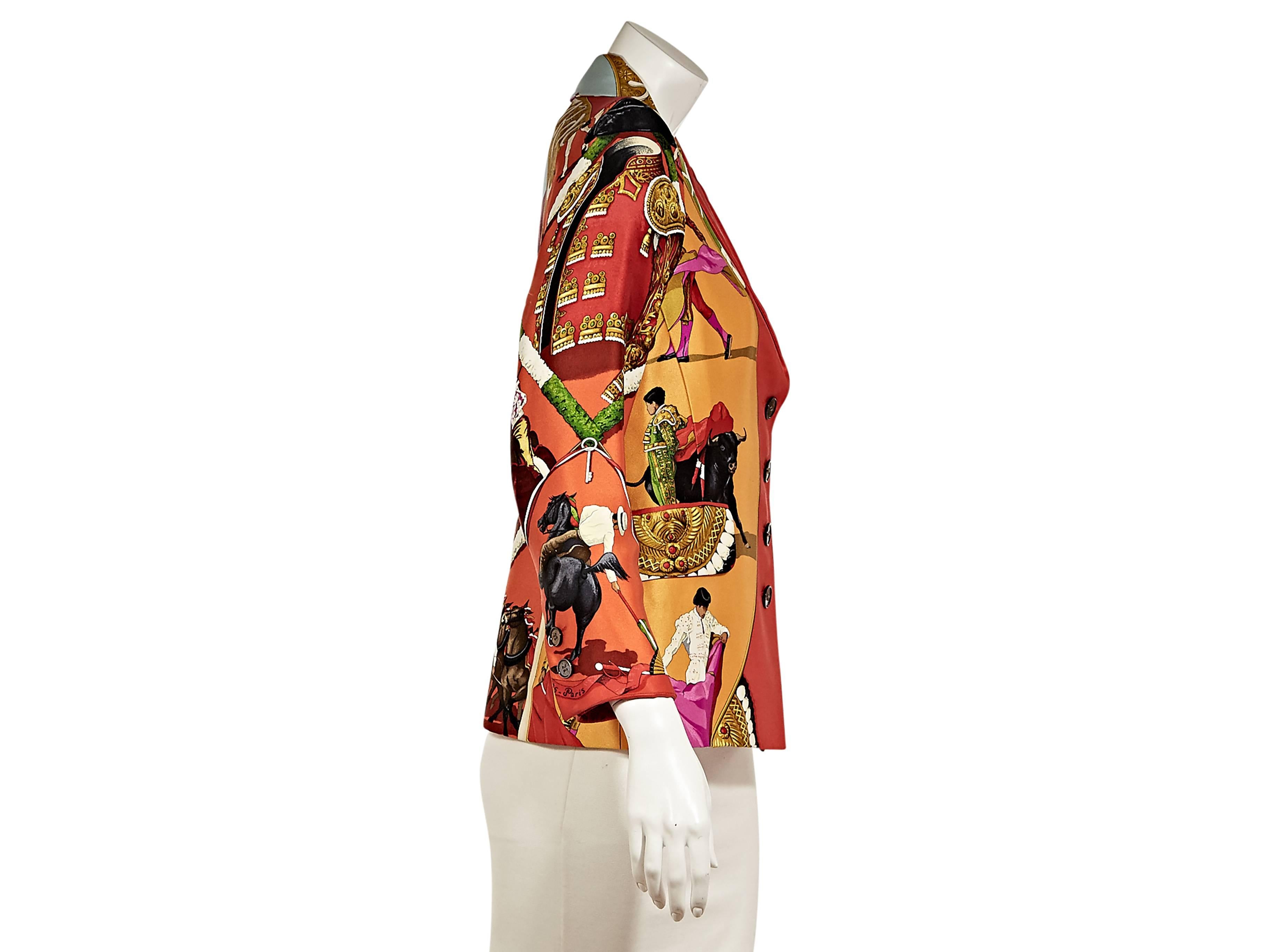 Multicolor printed silk blazer by Hermes.  Features a Spanish bullfighting motif.  Notched lapel.  Bracelet-length sleeves.  Two-button detail at cuffs.  Four-button closure. 