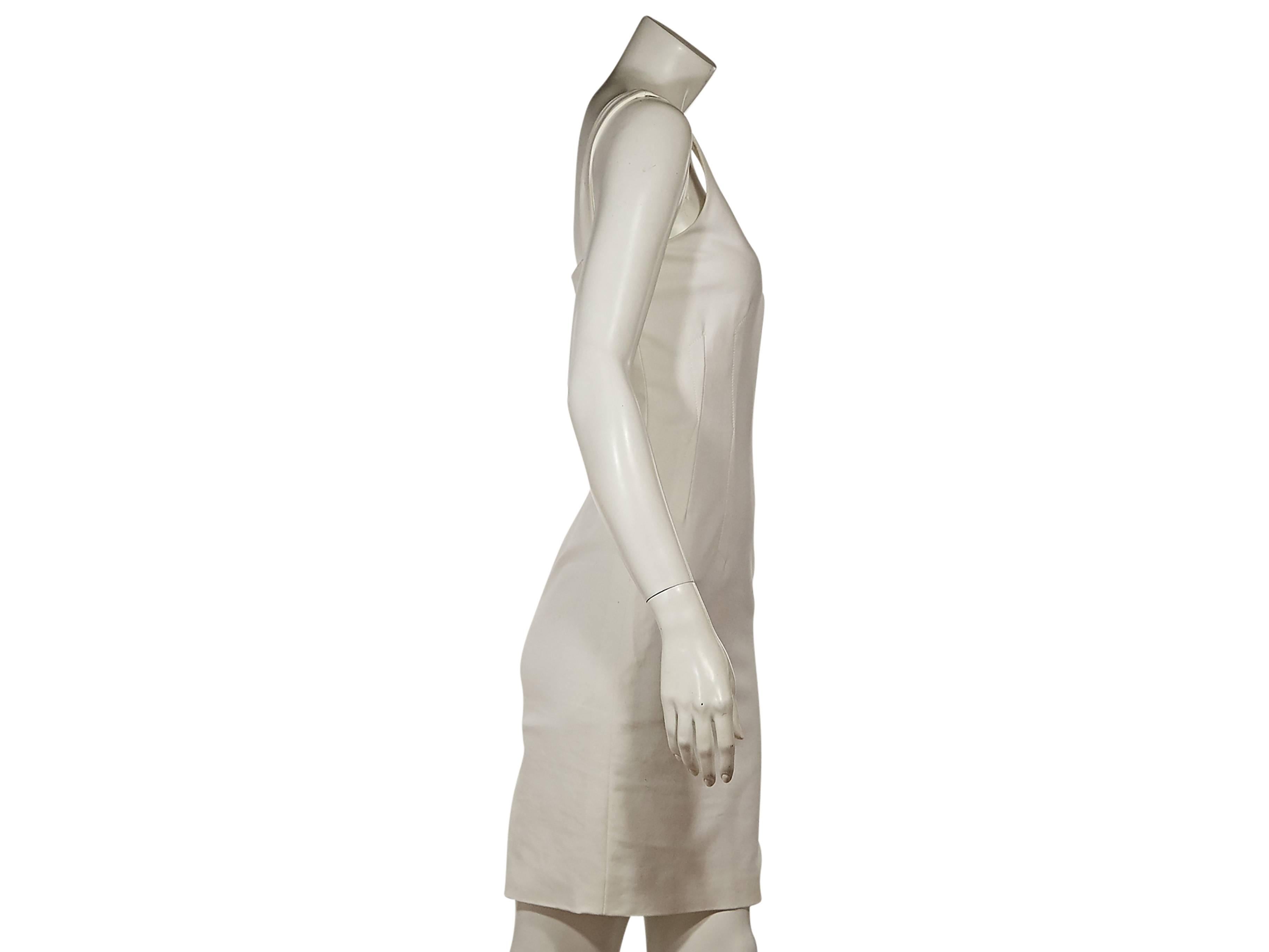 Product details:  White cotton sheath dress by Versace.  Side and back seams create a flattering silhouette.  Scoopneck.  Sleeveless.  Concealed back zip closure.  Back hem vent. 
Condition: Excellent.  