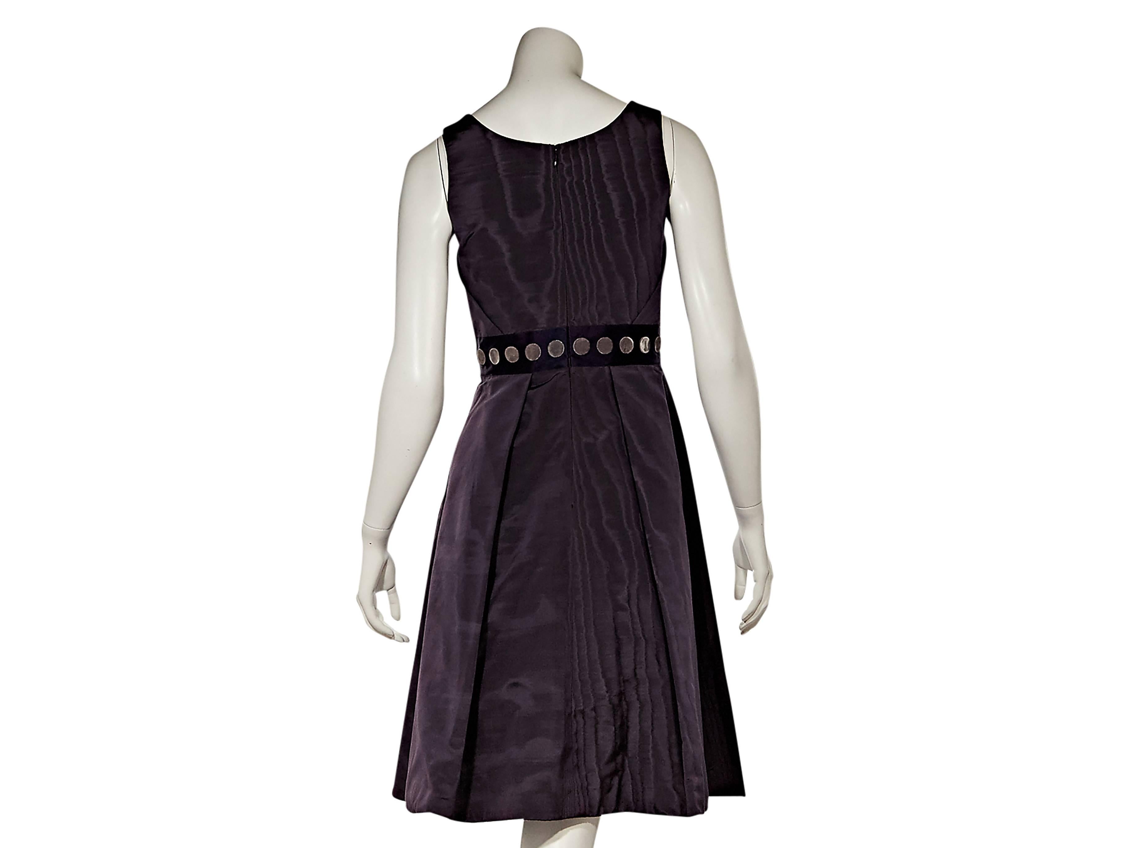 Product details:  Purple silk A-line dress by Carolina Herrera.  Scoopneck.  Sleeveless.  Velvet polka-dot belted waist.  Pleats taper off waist.  Concealed back zip closure. 
Condition: Excellent.  