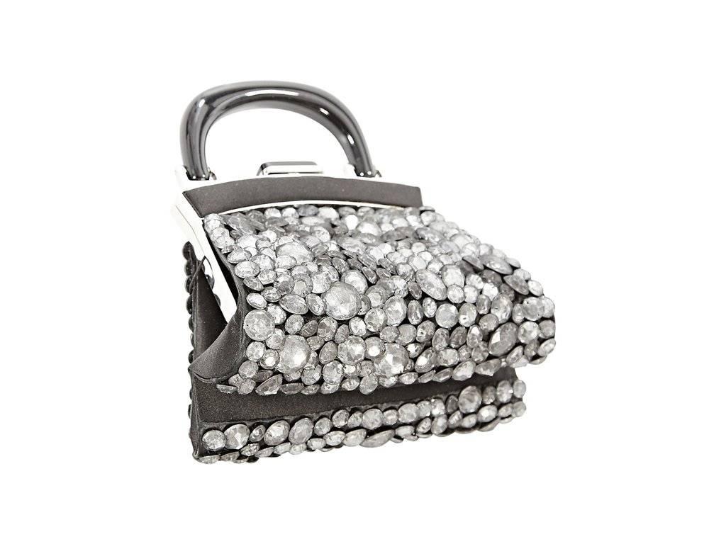 Product details: Crystal embellished evening bag by Giorgio Armani. Top carry handle. Push-lock closure. Lined interior with slide pocket. Silvertone hardware. 7.5