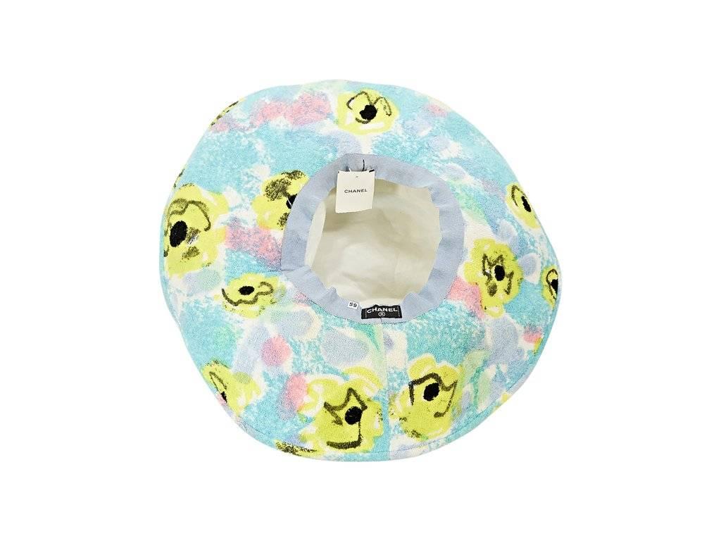 Product details:  Blue, yellow and pink printed beach hat by Chanel.  Lined interior.  
Condition: Excellent.  New with tags.